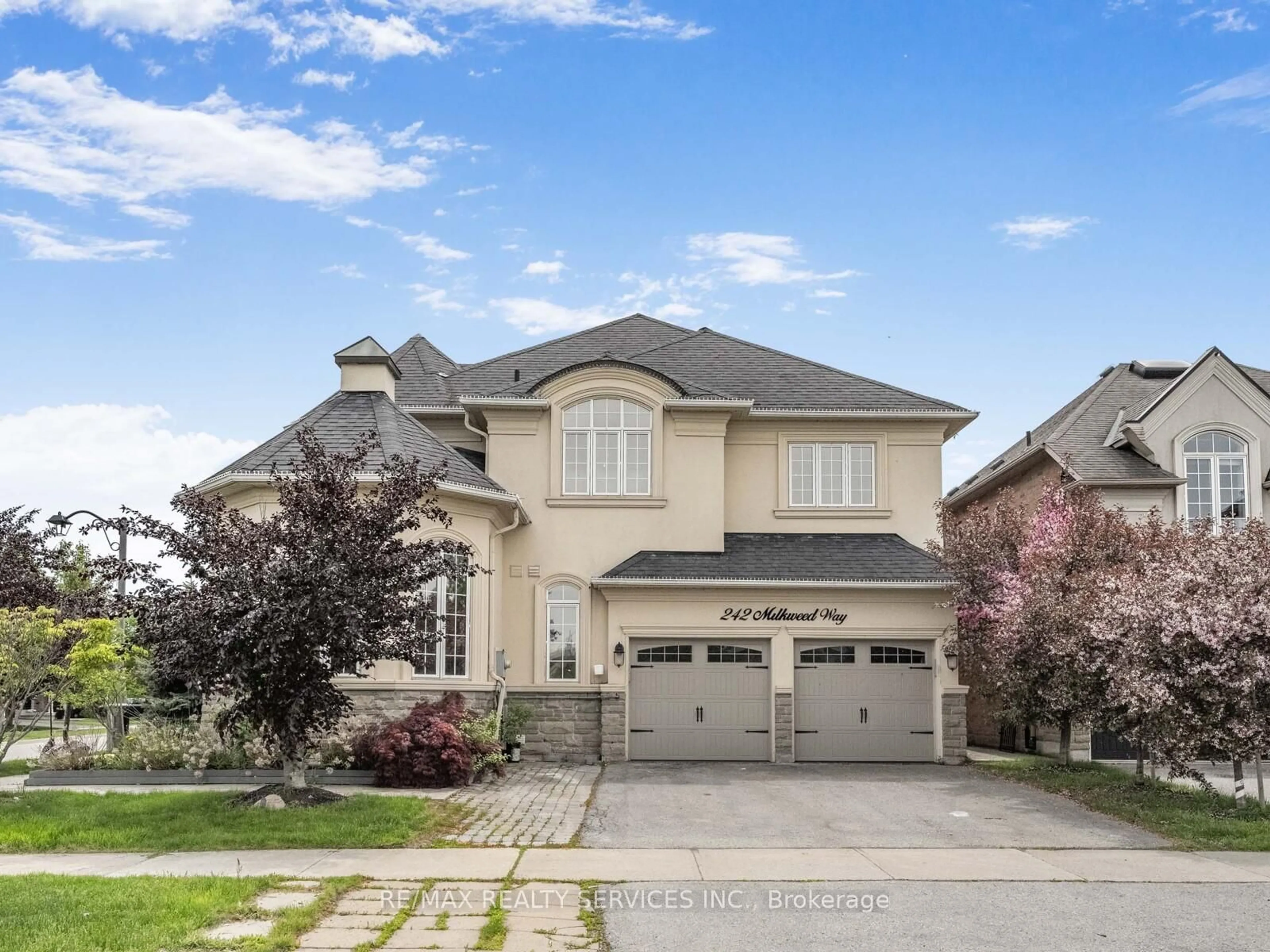 Home with brick exterior material, street for 242 Milkweed Way, Oakville Ontario L6L 0A6
