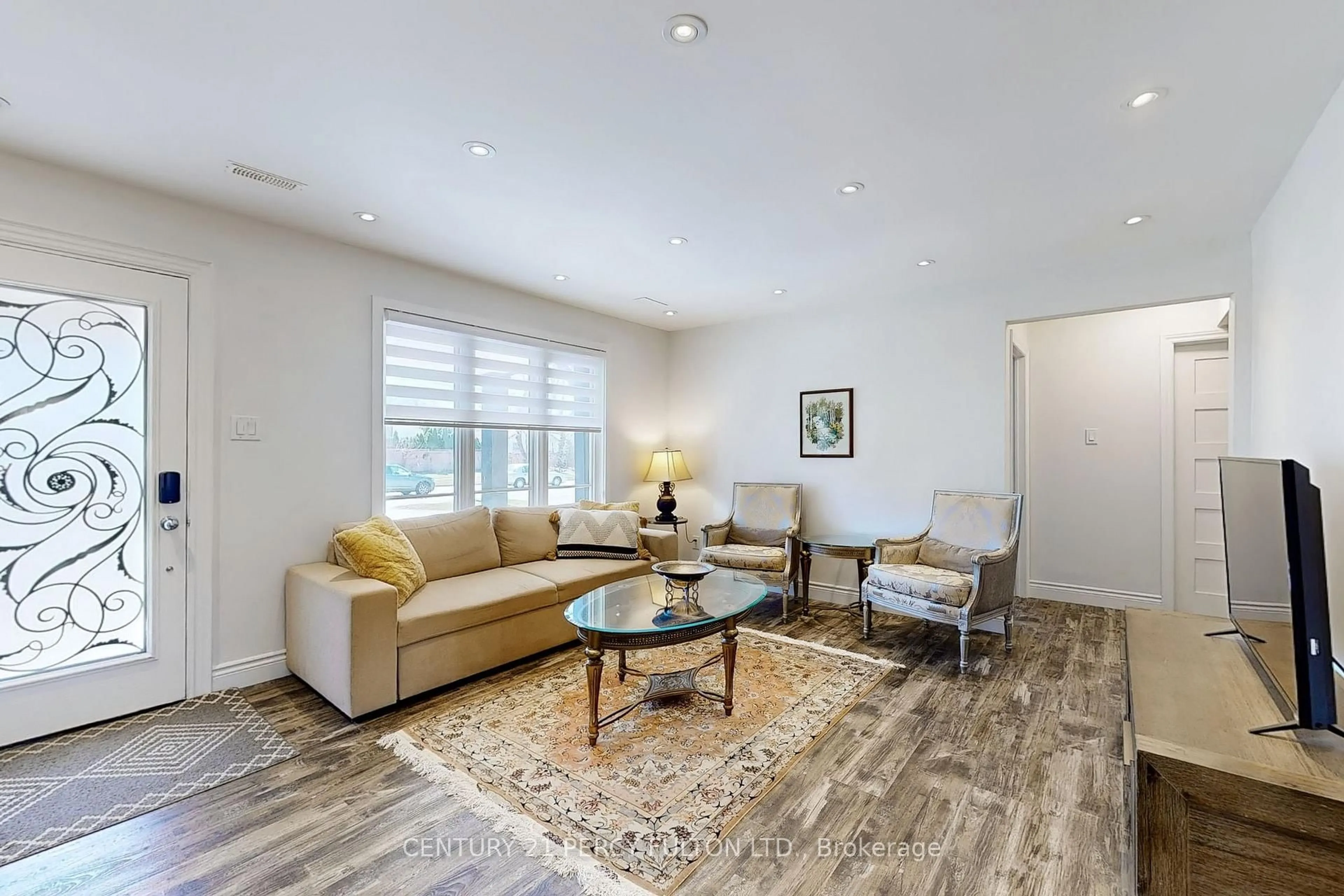 Living room with furniture, wood/laminate floor for 3489 New St, Burlington Ontario L7N 1N5