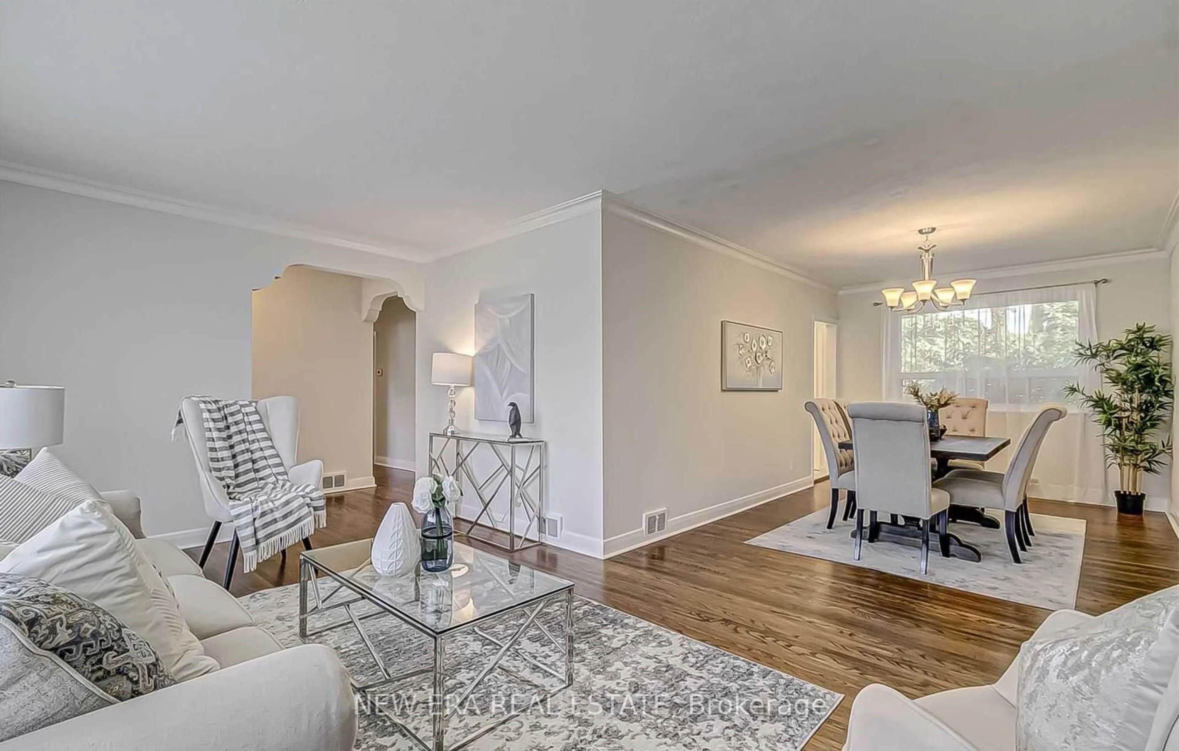 Living room with furniture, wood/laminate floor for 7 Greening Cres, Toronto Ontario M9A 1N9