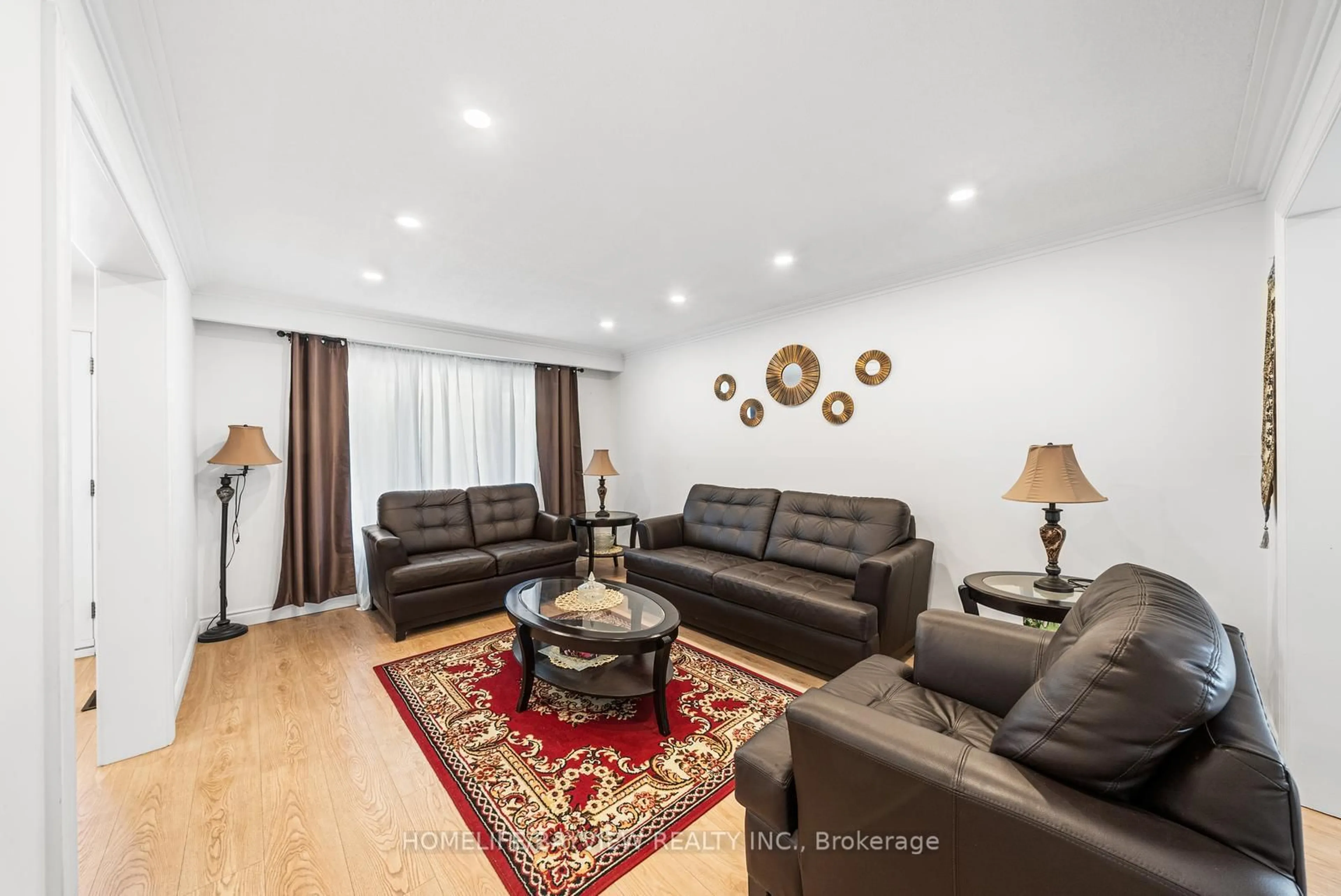 Living room with furniture, wood/laminate floor for 2602 Mason Hts, Mississauga Ontario L5B 2S2