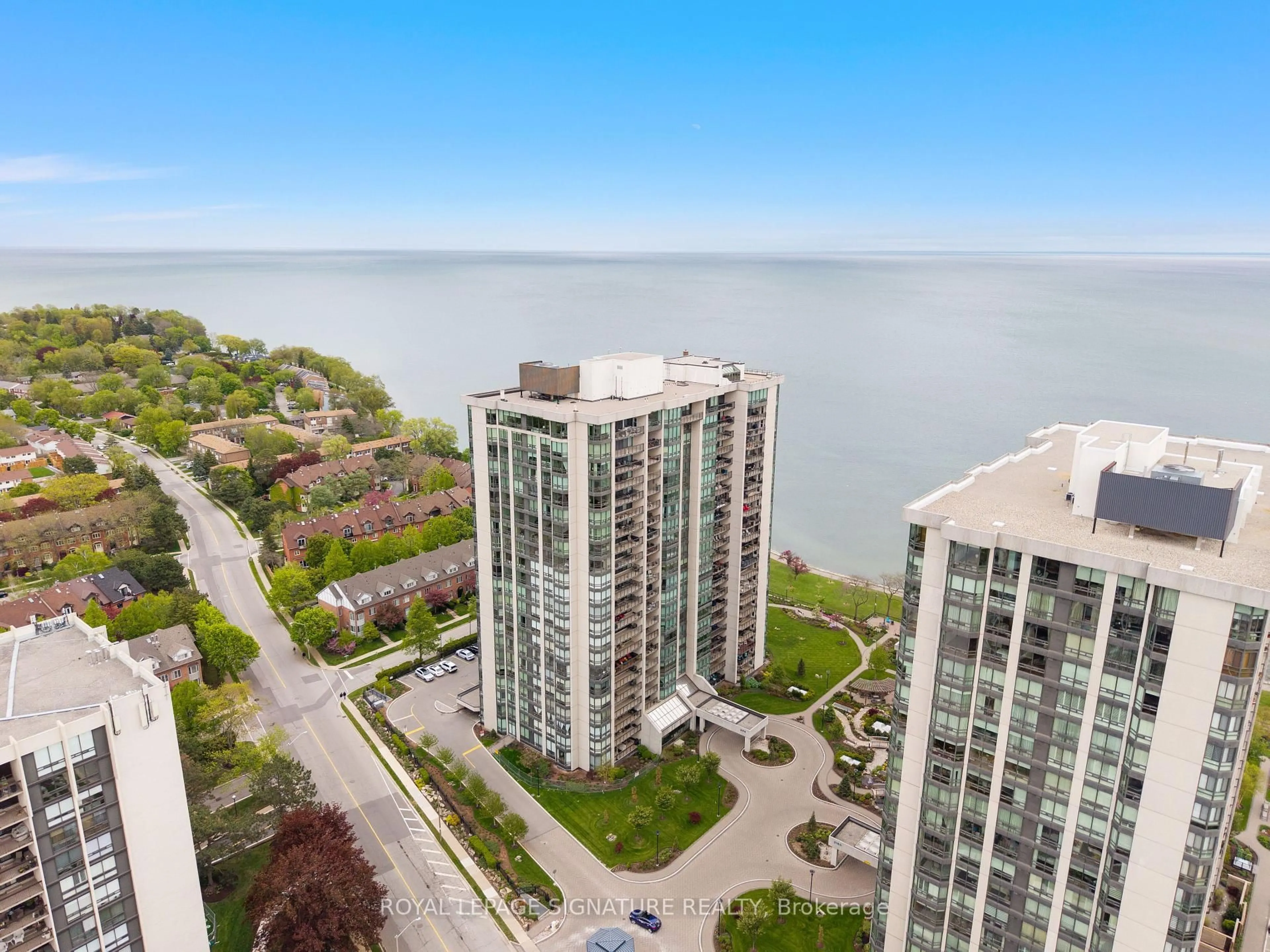 A pic from outside/outdoor area/front of a property/back of a property/a pic from drone, water/lake/river/ocean view for 2170 Marine Dr #307, Oakville Ontario L6L 5V1