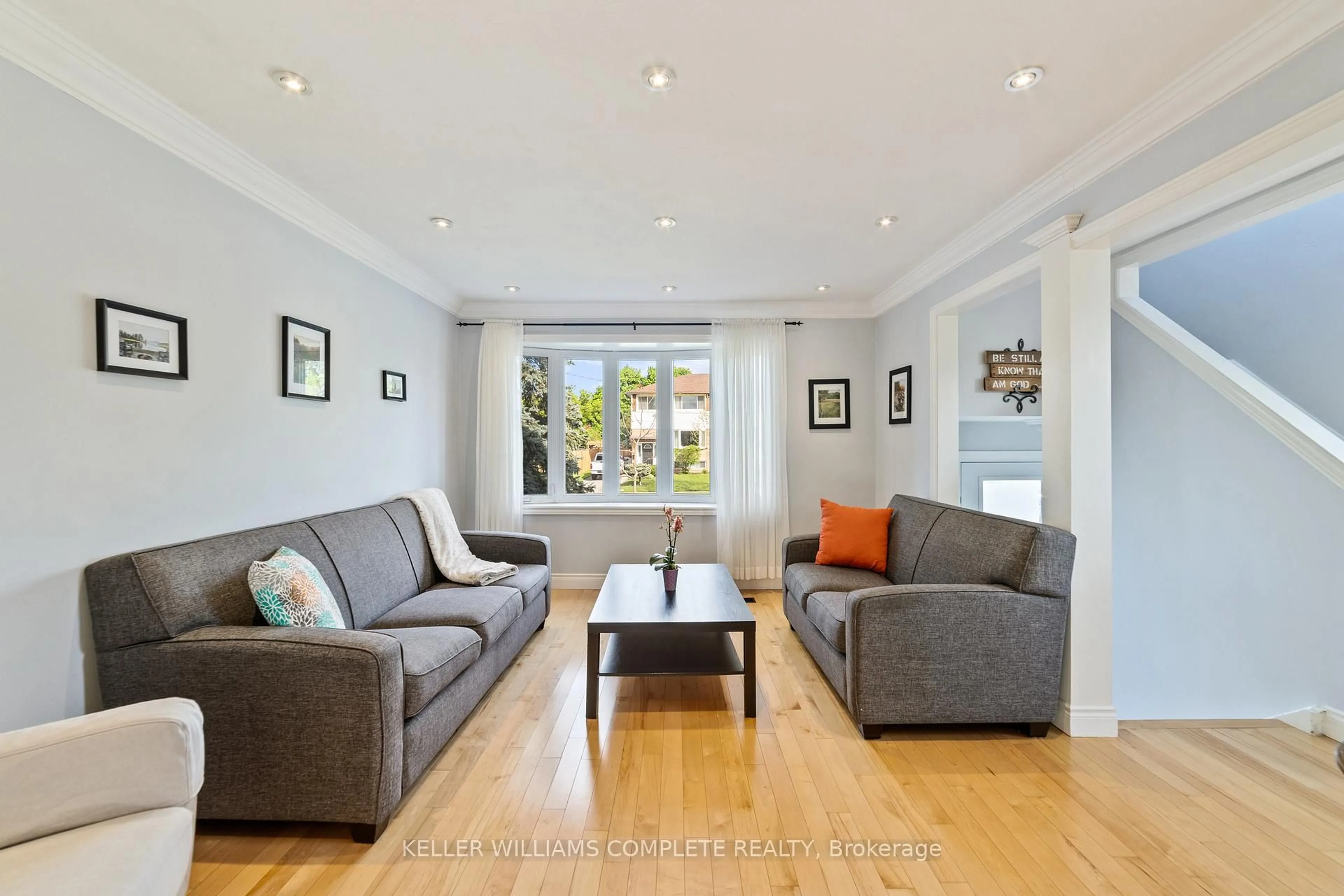 Living room with furniture, wood/laminate floor for 4528 Bennett Rd, Burlington Ontario L7L 1Z2