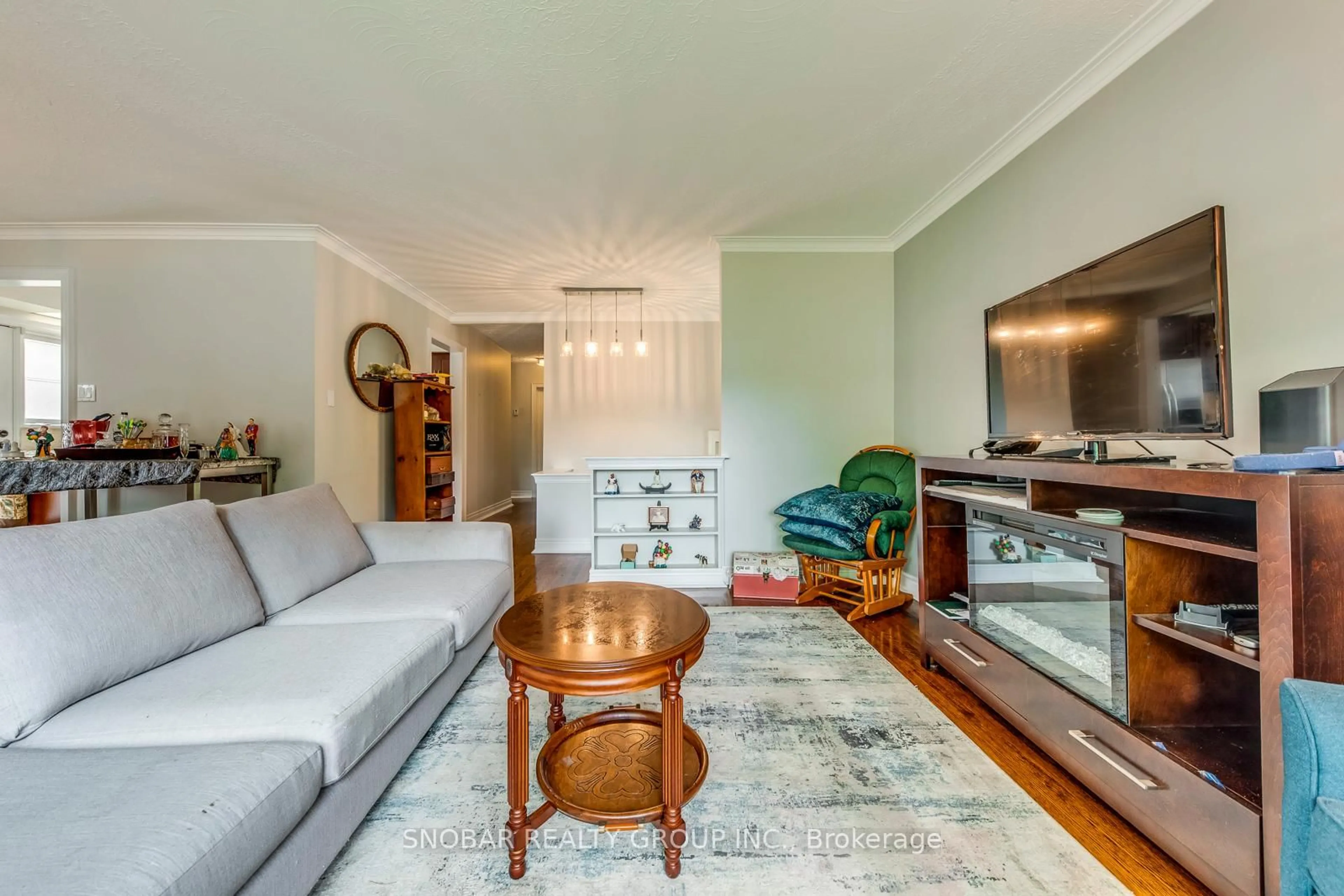 Living room with furniture, wood/laminate floor for 40 Fletcher Pl, Toronto Ontario M9R 1K6