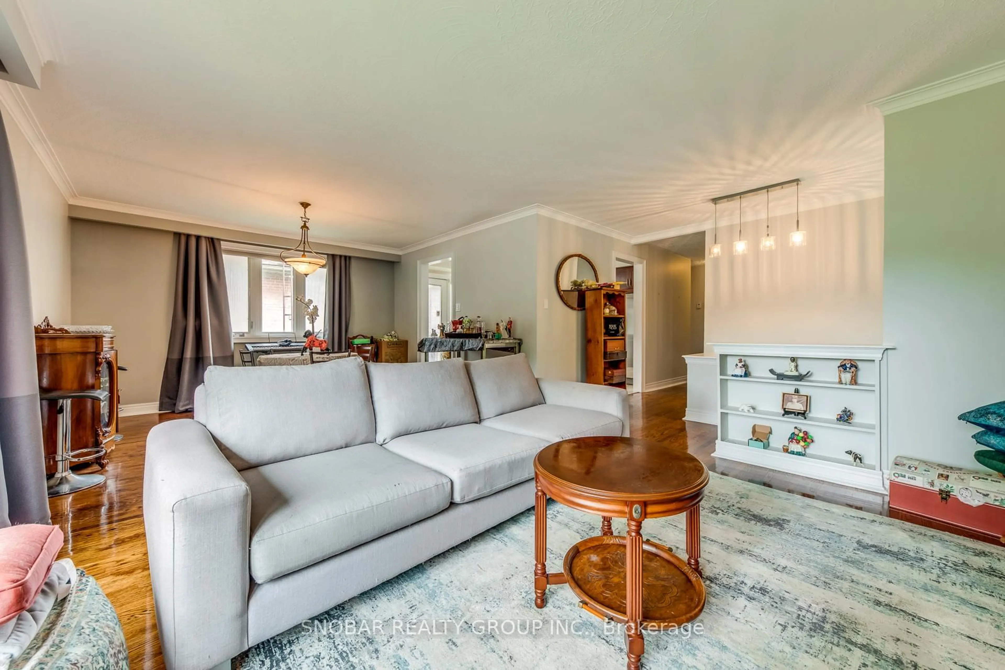 Living room with furniture, wood/laminate floor for 40 Fletcher Pl, Toronto Ontario M9R 1K6