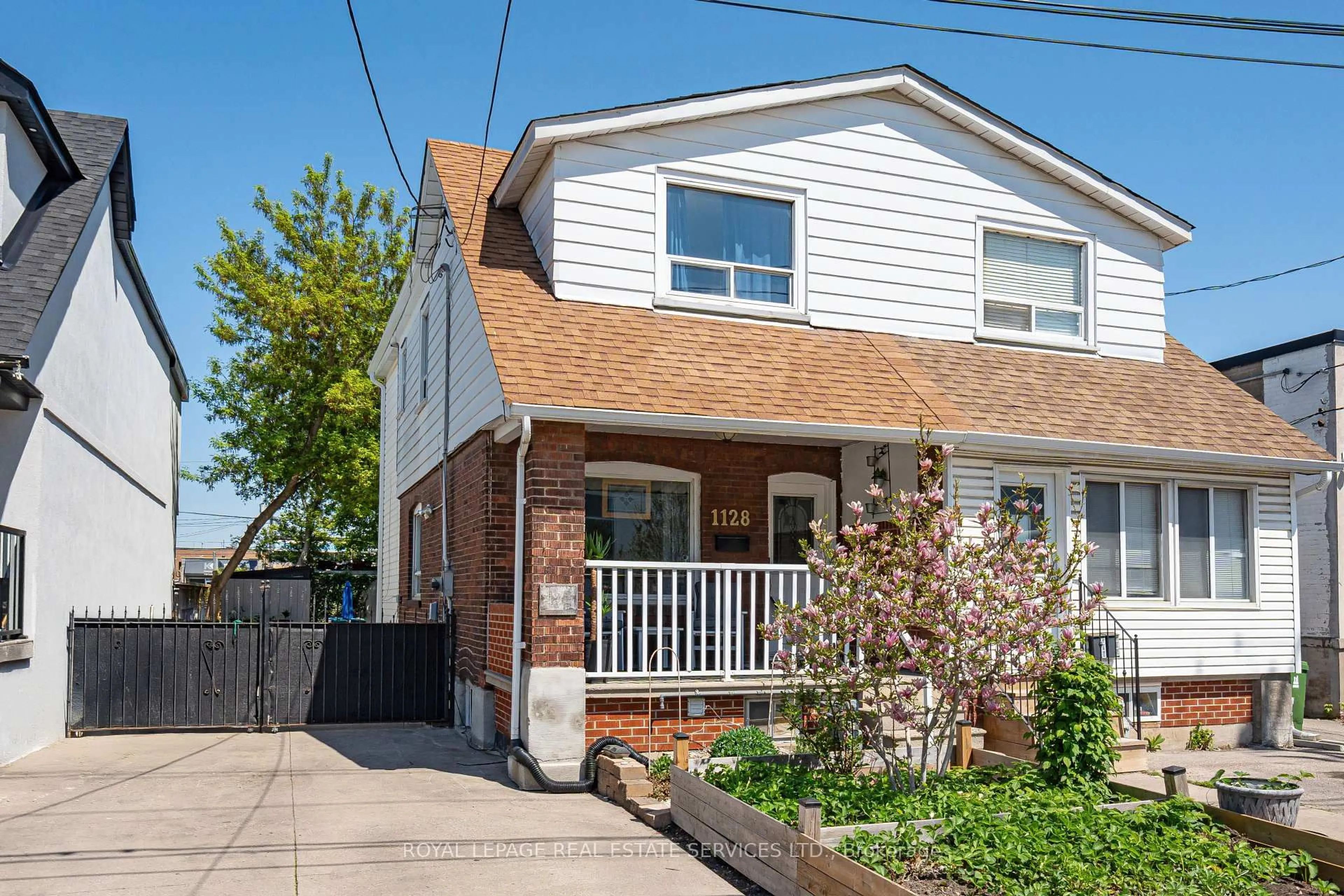 Home with brick exterior material, street for 1128 Roselawn Ave, Toronto Ontario M6B 1C4