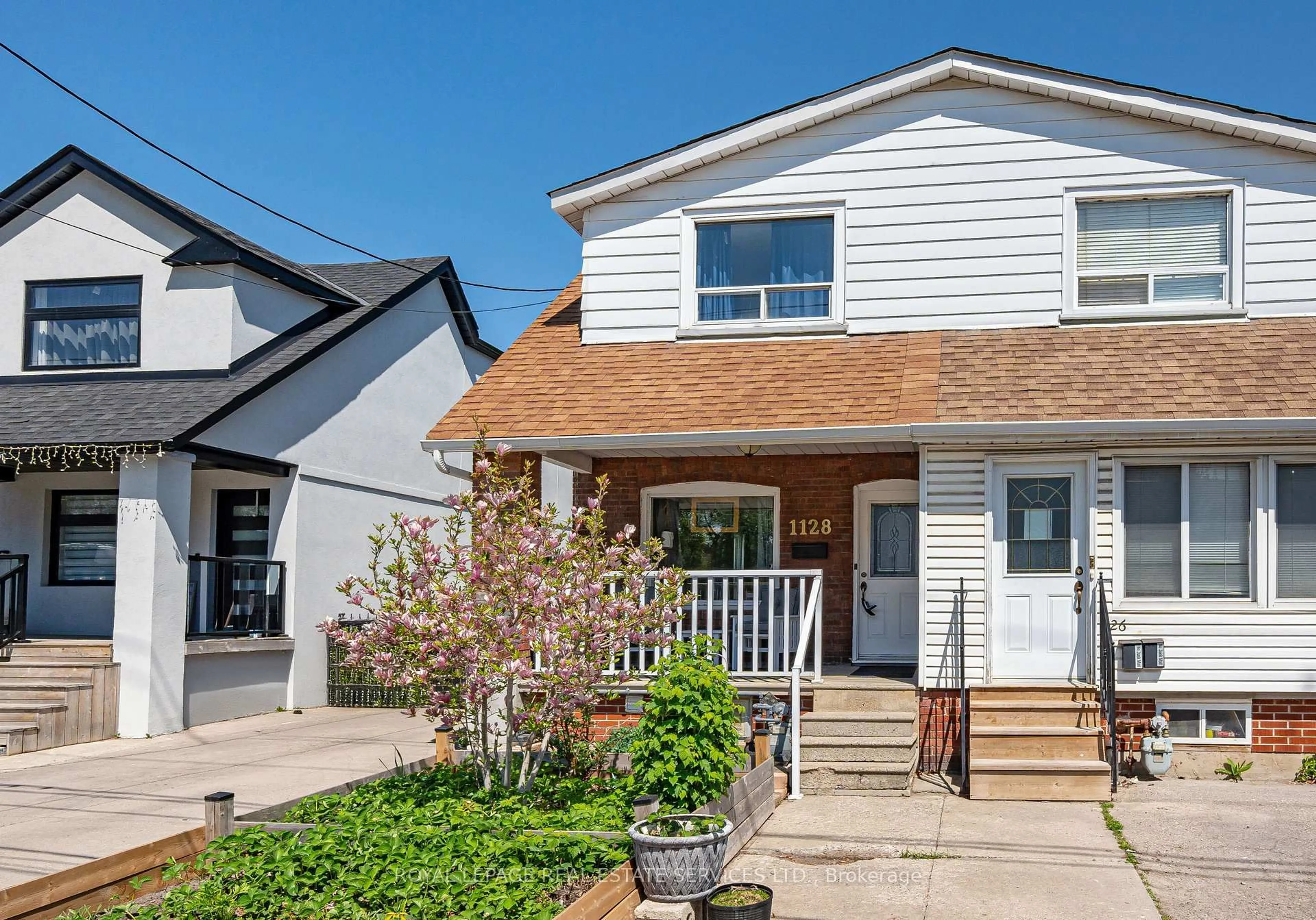Home with vinyl exterior material, street for 1128 Roselawn Ave, Toronto Ontario M6B 1C4