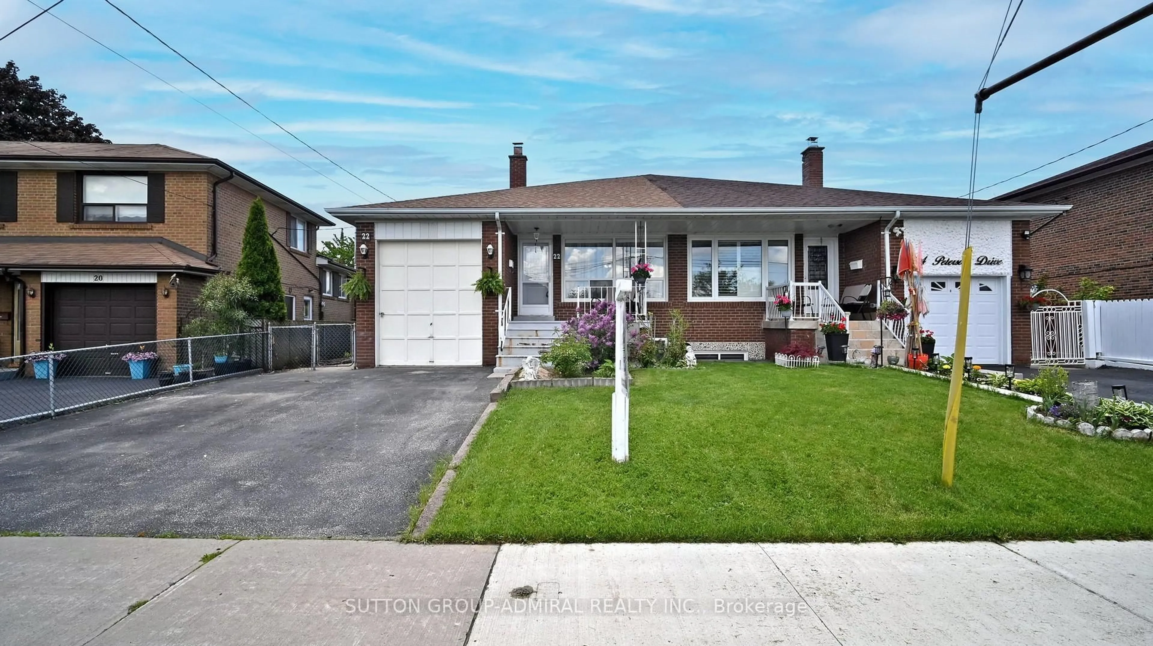 Home with brick exterior material, street for 22 Peterson Dr, Toronto Ontario M9M 1X1
