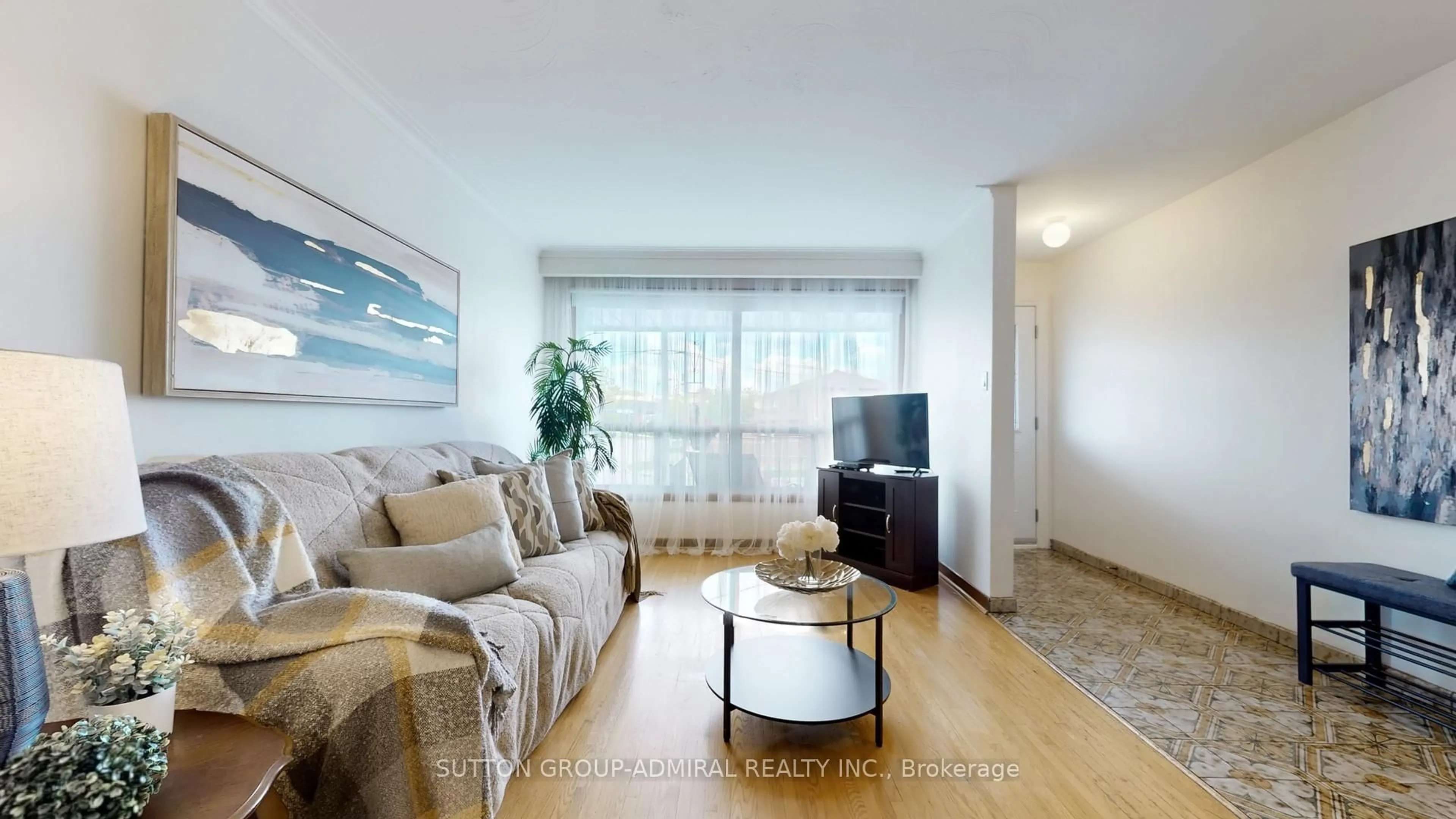 Living room with furniture, wood/laminate floor for 22 Peterson Dr, Toronto Ontario M9M 1X1