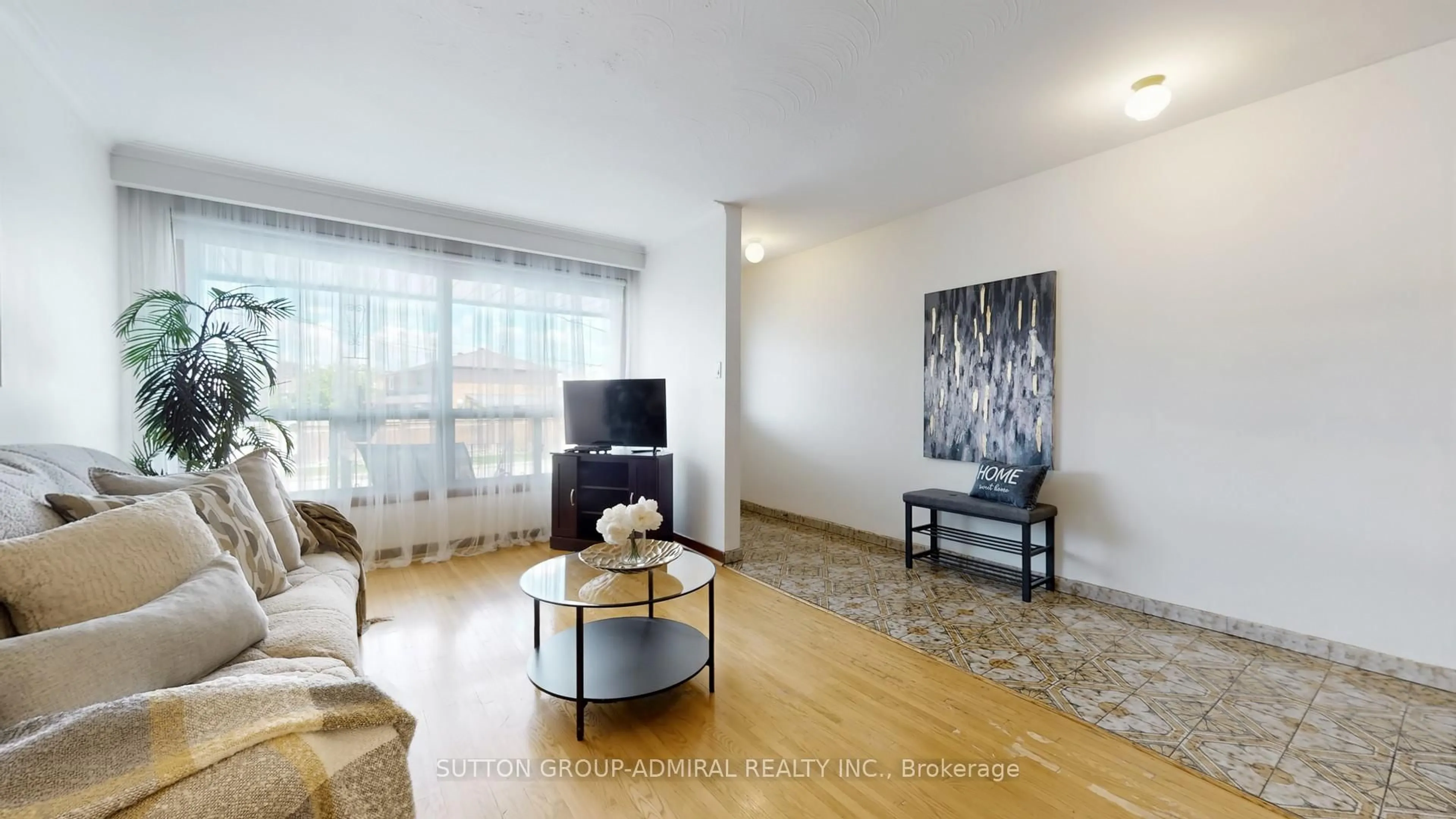 Living room with furniture, wood/laminate floor for 22 Peterson Dr, Toronto Ontario M9M 1X1