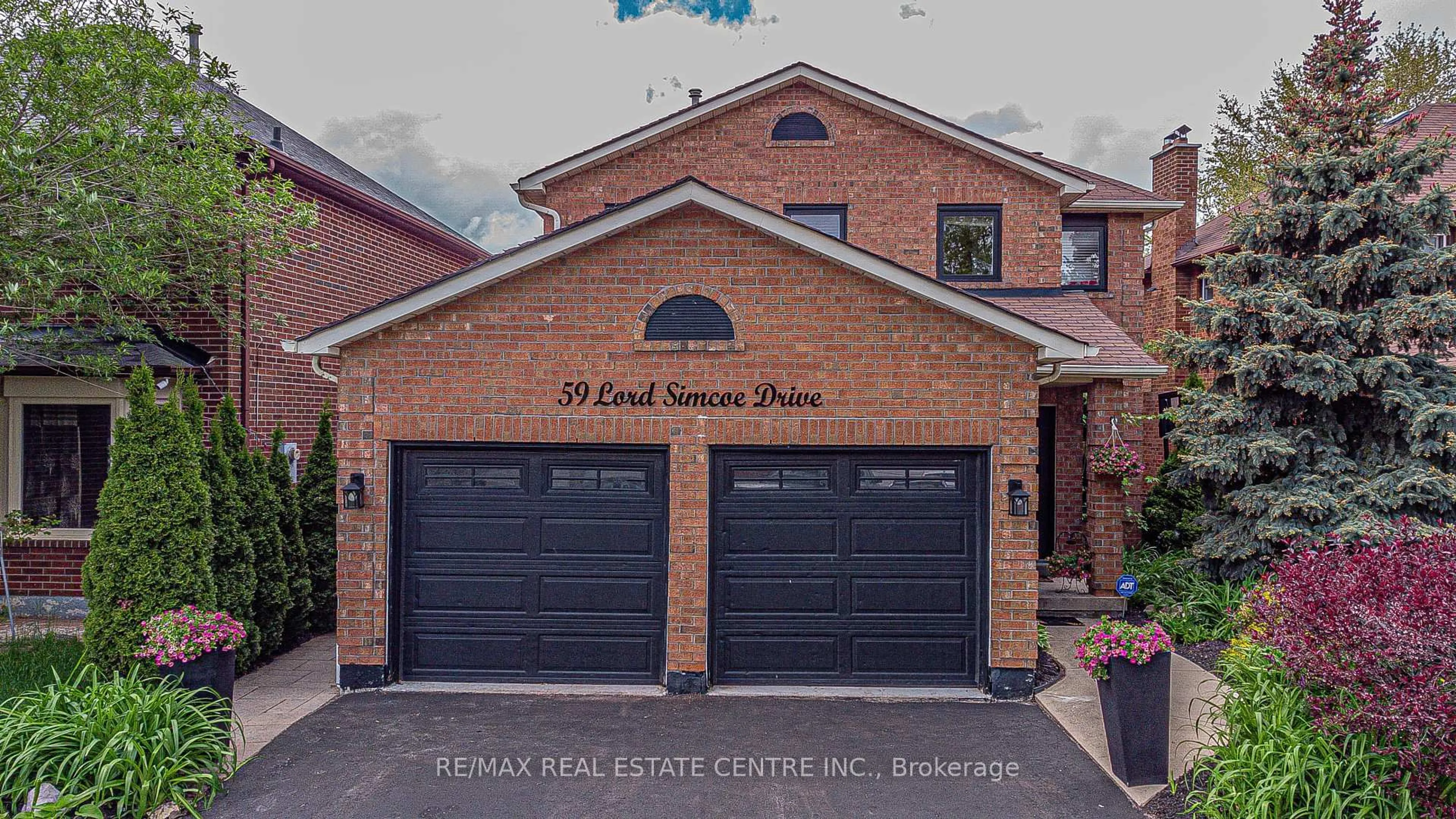 Home with brick exterior material, street for 59 Lord Simcoe Dr, Brampton Ontario L6S 5G7
