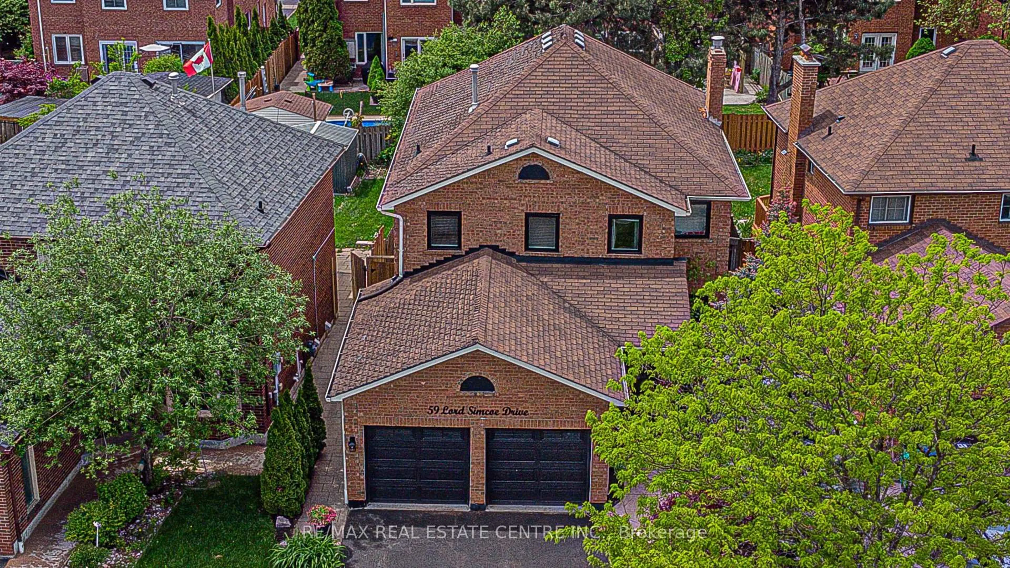 Home with brick exterior material, street for 59 Lord Simcoe Dr, Brampton Ontario L6S 5G7