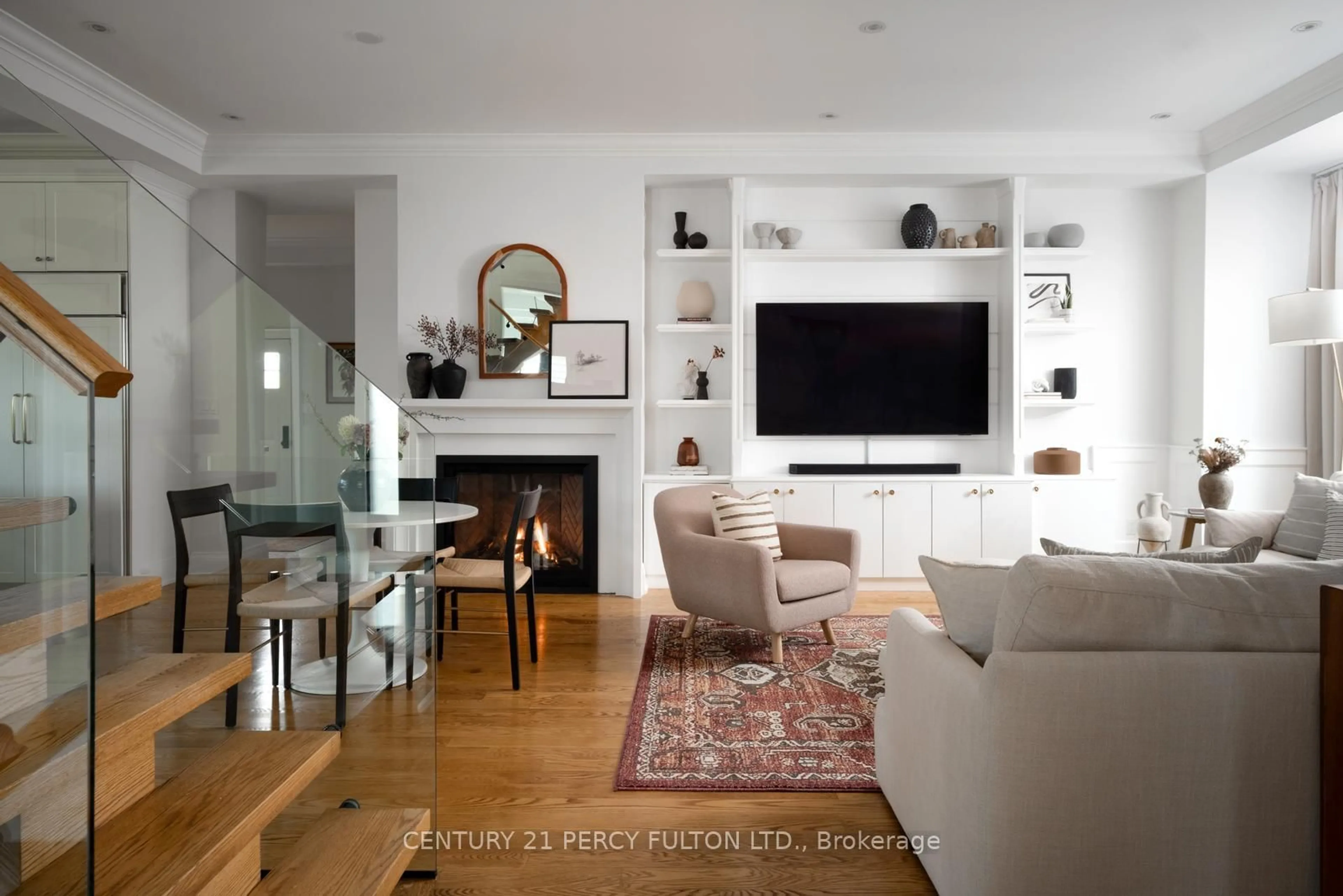 Living room with furniture, wood/laminate floor for 95 Great Oak Dr, Toronto Ontario M9A 1N7