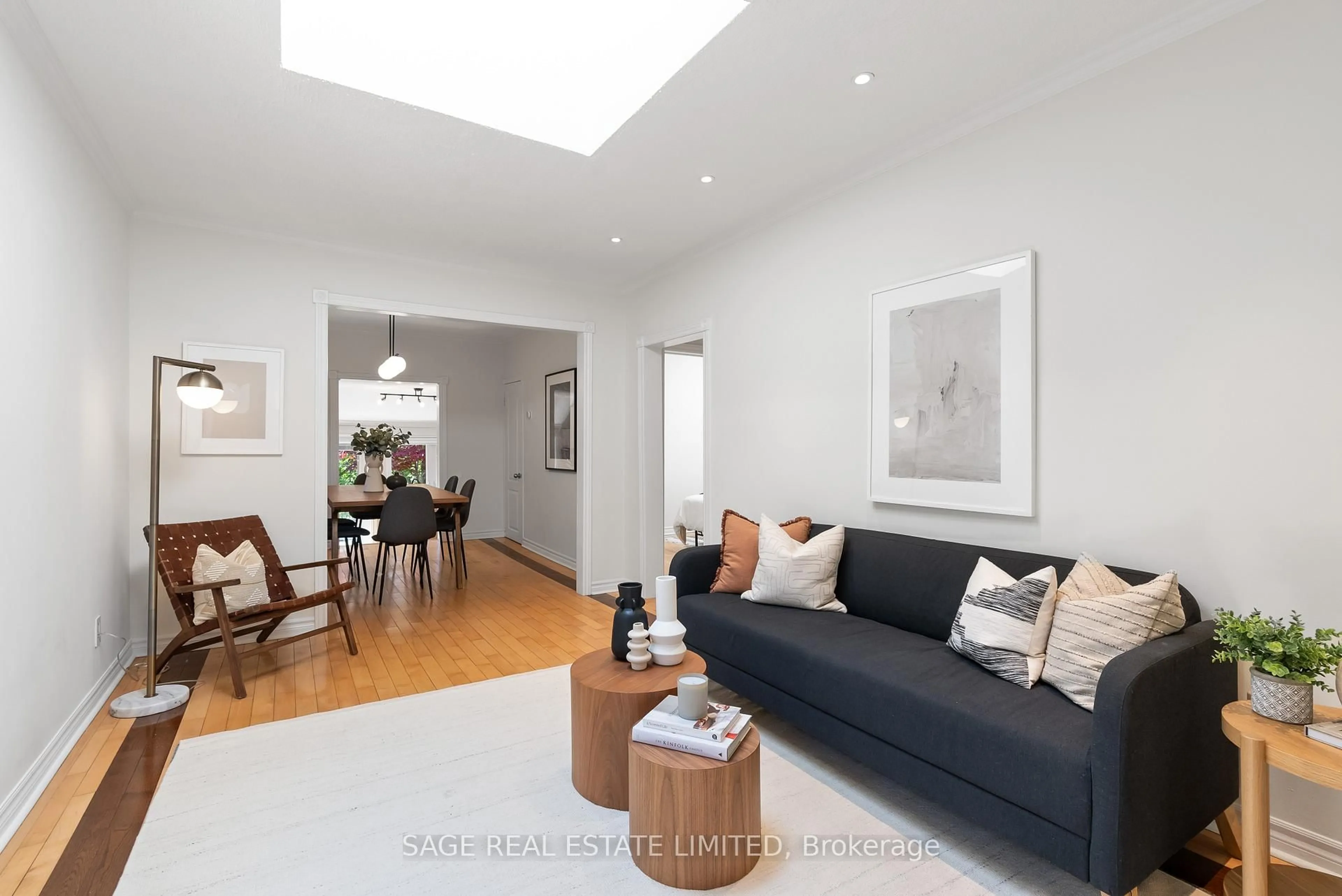 Living room with furniture, wood/laminate floor for 4047 Old Dundas St, Toronto Ontario M6S 2R5