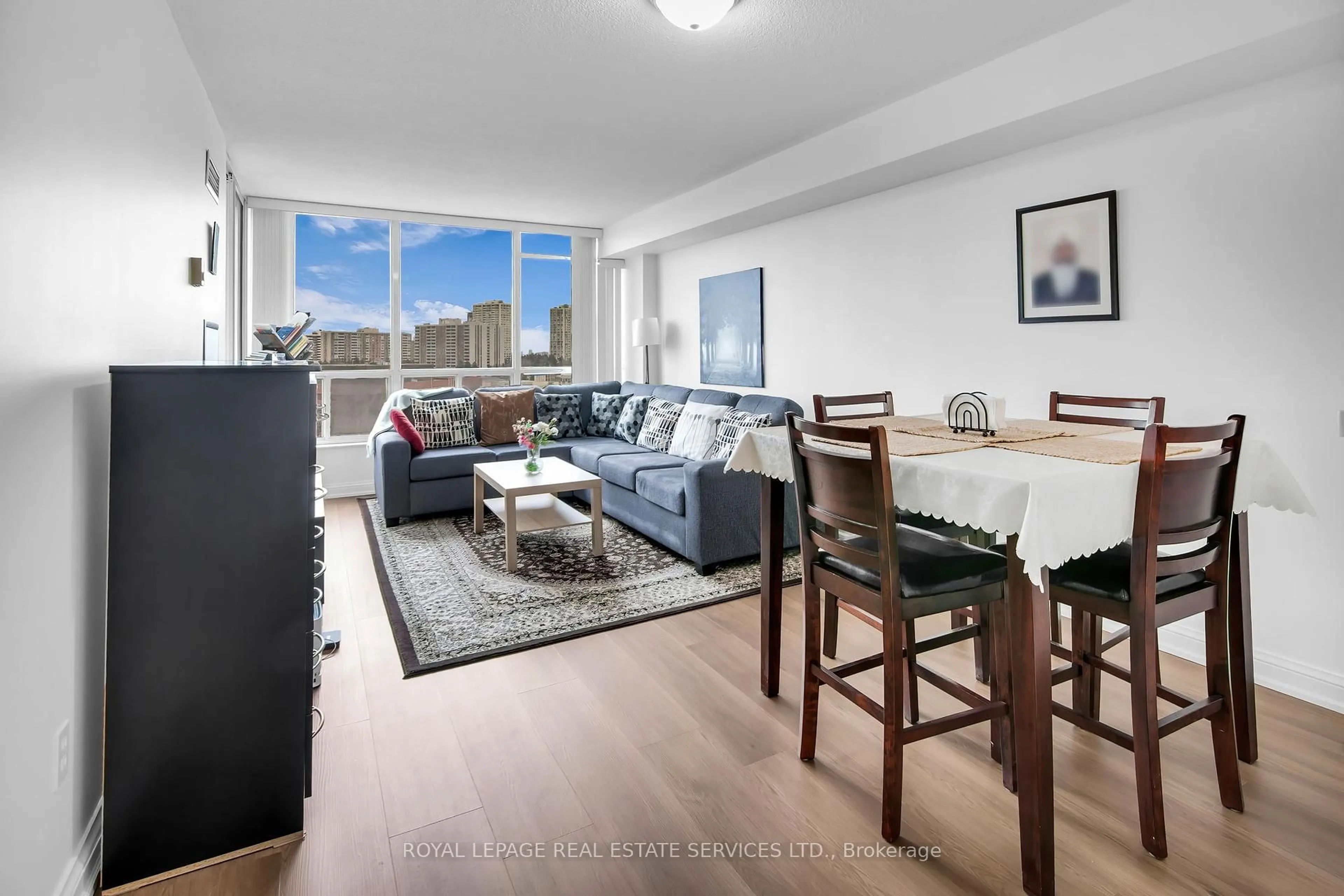 Living room with furniture, wood/laminate floor for 24 Hanover Rd #708, Brampton Ontario L6S 5K8