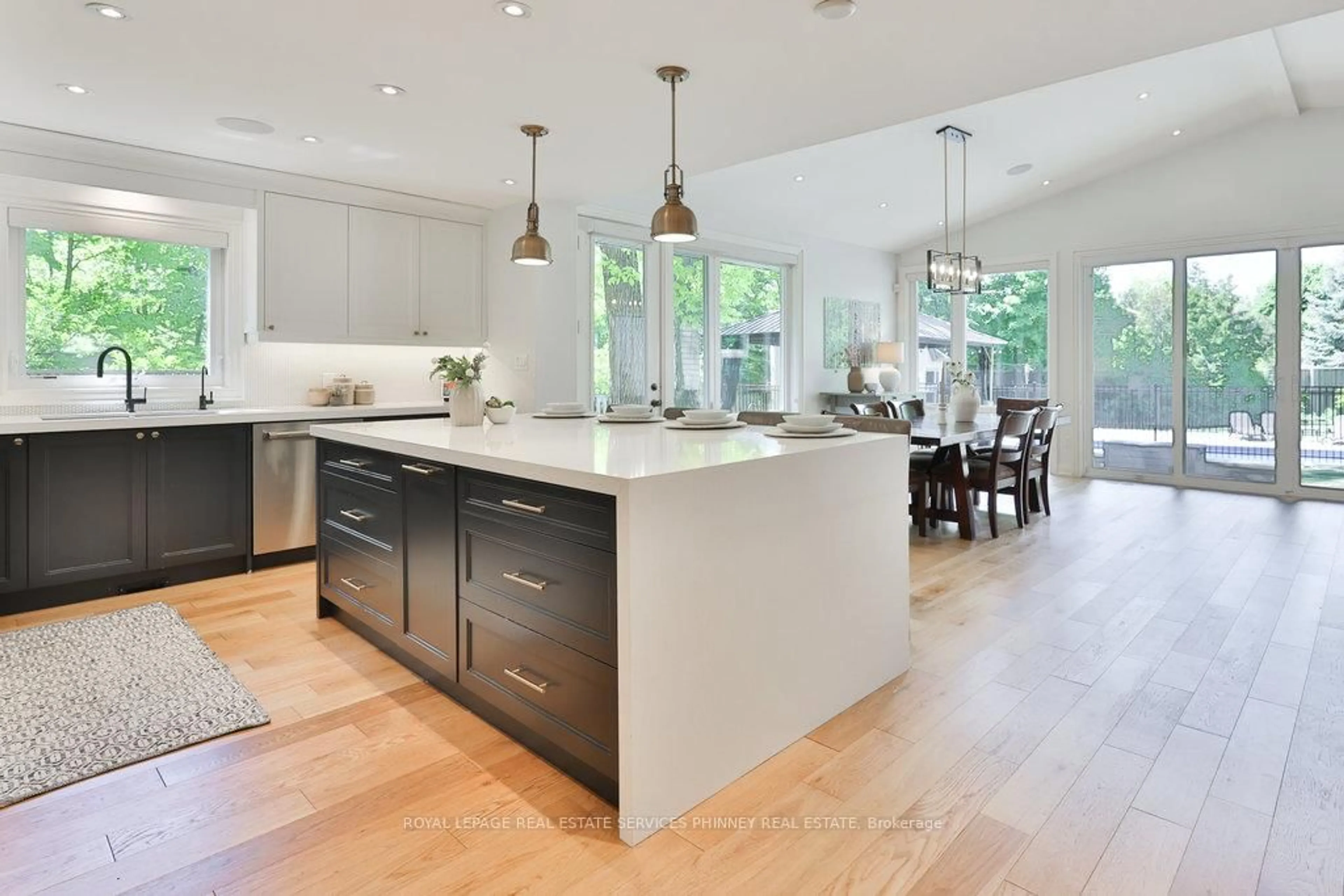 Open concept kitchen, wood/laminate floor for 3661 Greenbower Crt, Mississauga Ontario L5L 1P3