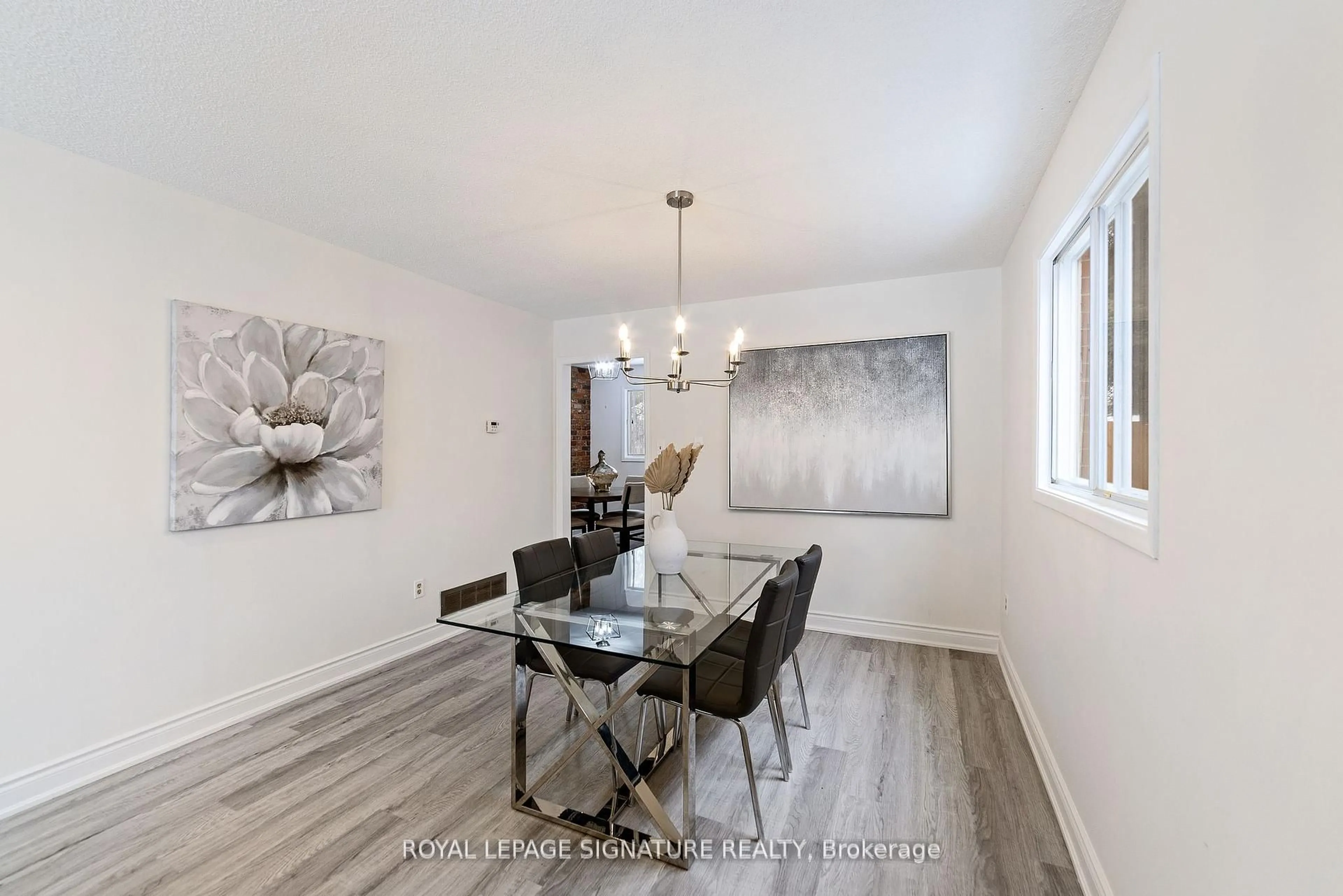 Dining room, wood/laminate floor for 11 Kirkland Rd, Brampton Ontario L6V 2W5