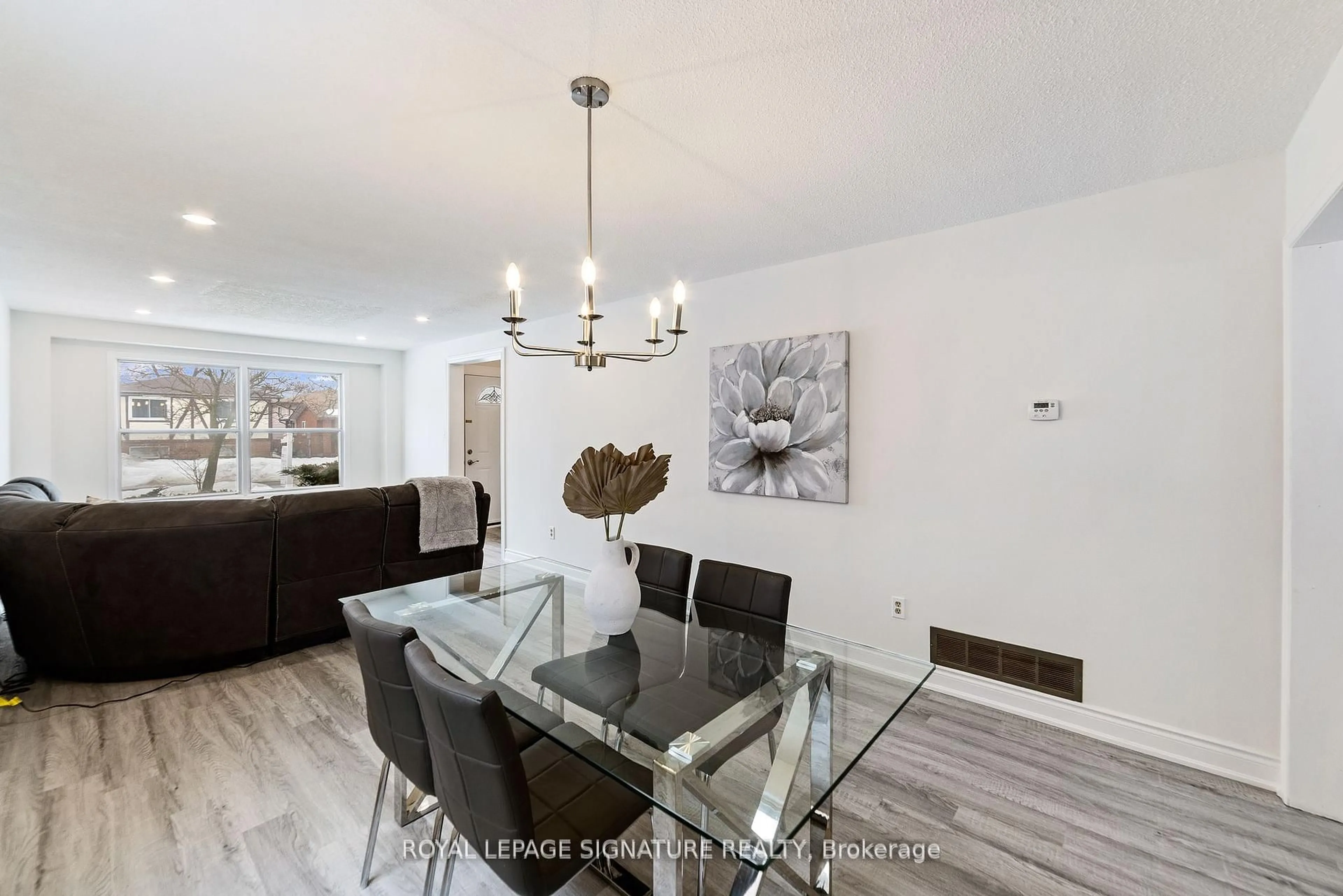 Dining room, wood/laminate floor for 11 Kirkland Rd, Brampton Ontario L6V 2W5