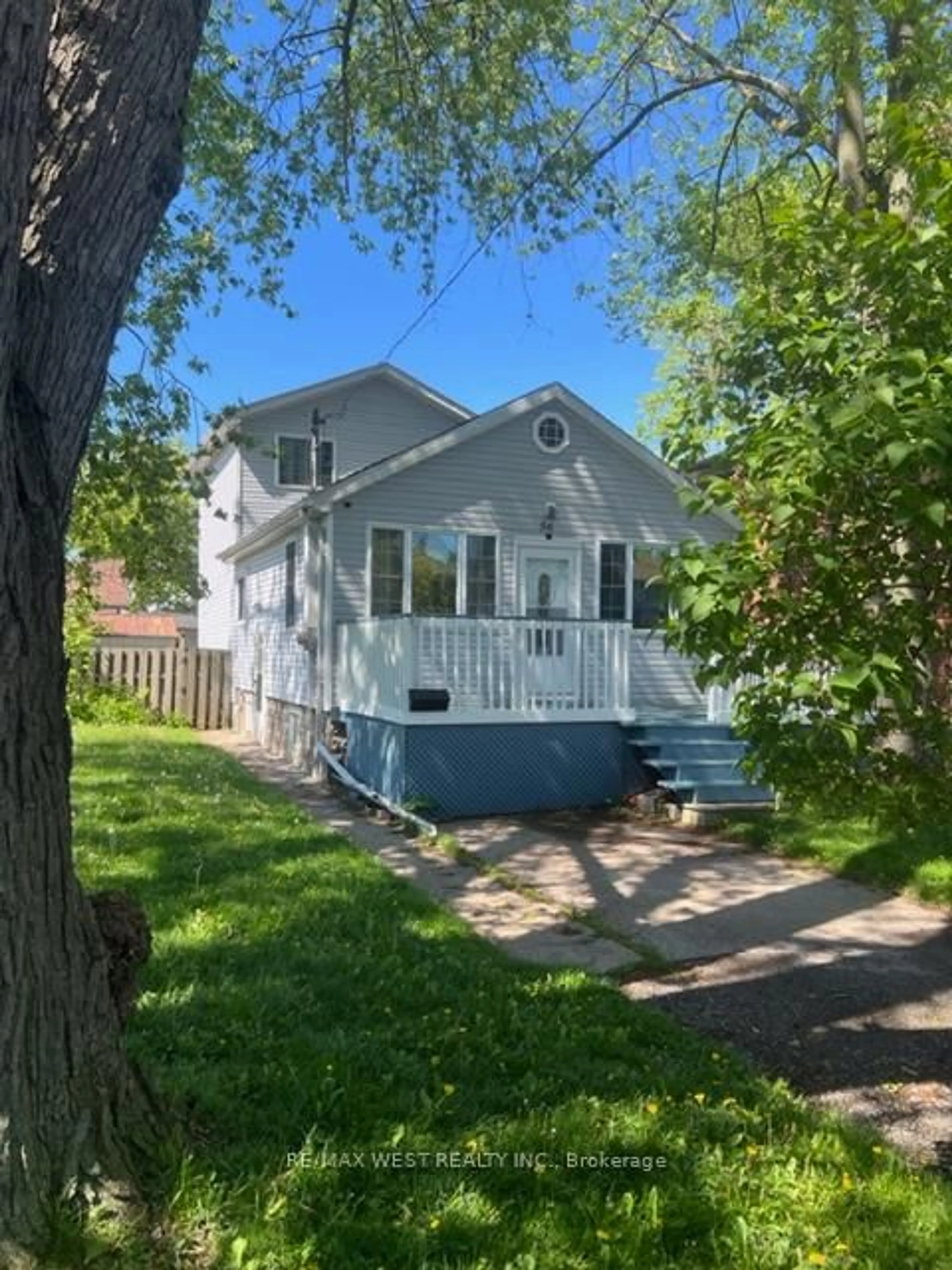 Home with vinyl exterior material, street for 56 Forty First St, Toronto Ontario M8W 3N6