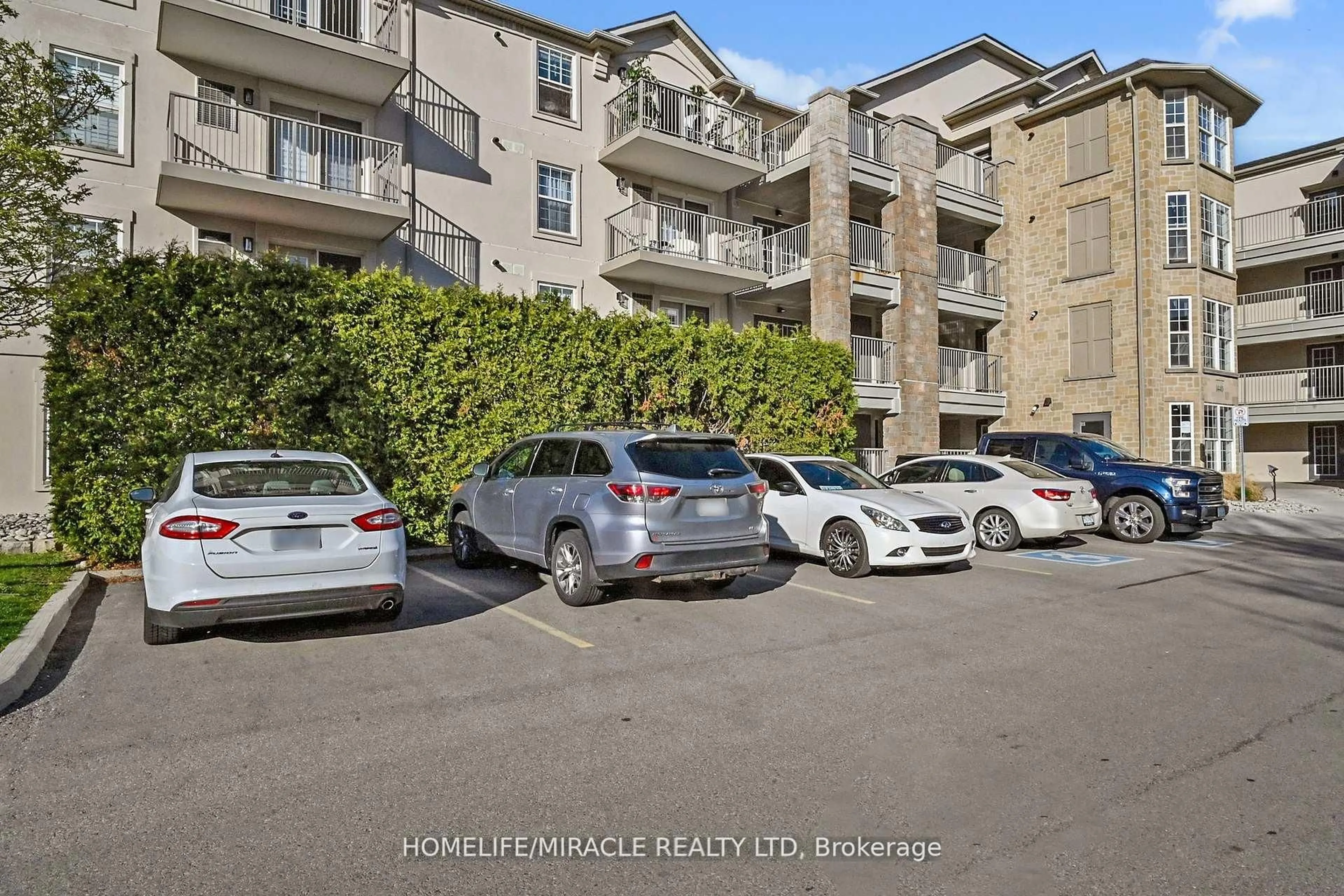 A pic from outside/outdoor area/front of a property/back of a property/a pic from drone, street for 1440 Bishops Gate #306, Oakville Ontario L6M 4M9