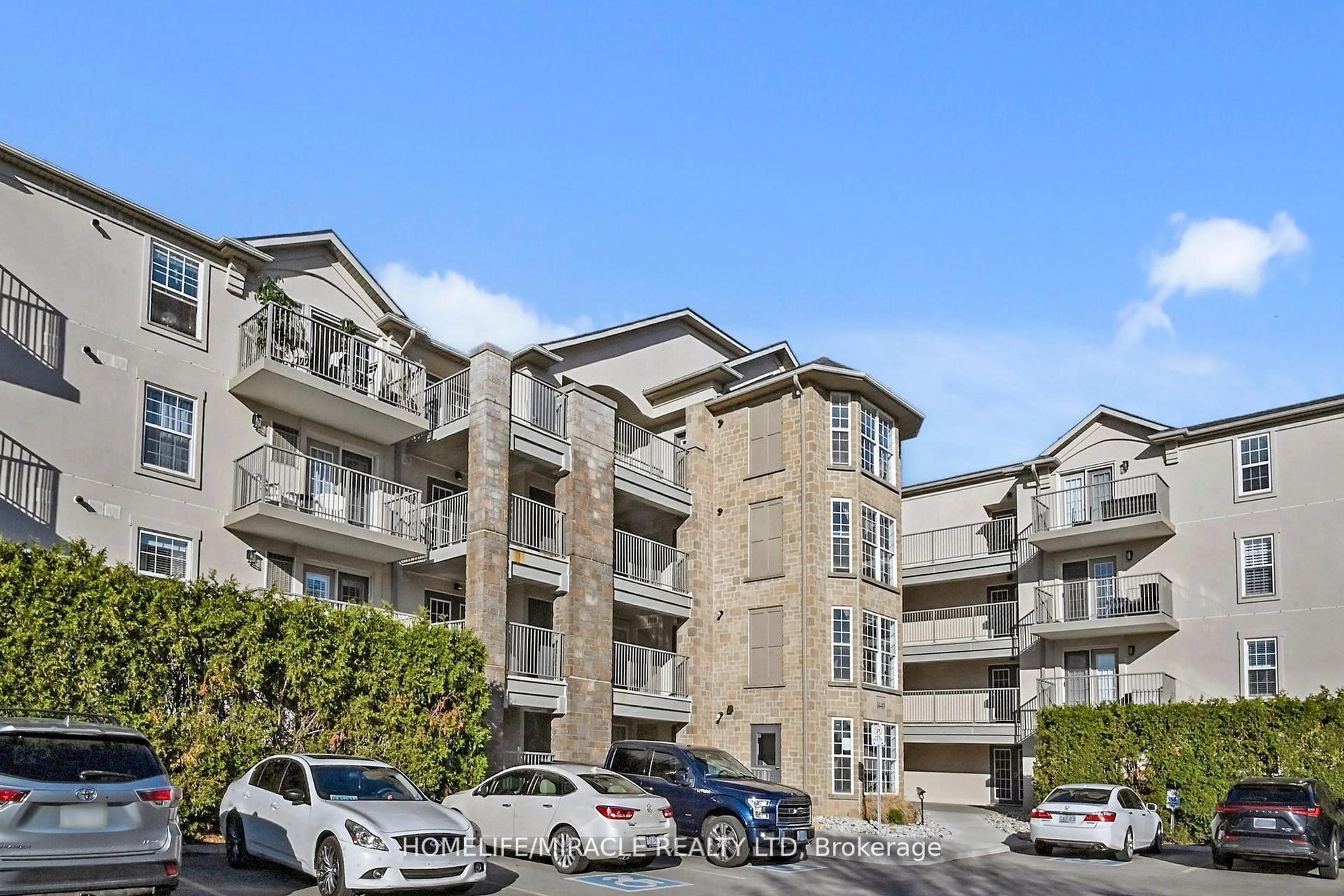 A pic from outside/outdoor area/front of a property/back of a property/a pic from drone, mountain view for 1440 Bishops Gate #306, Oakville Ontario L6M 4M9