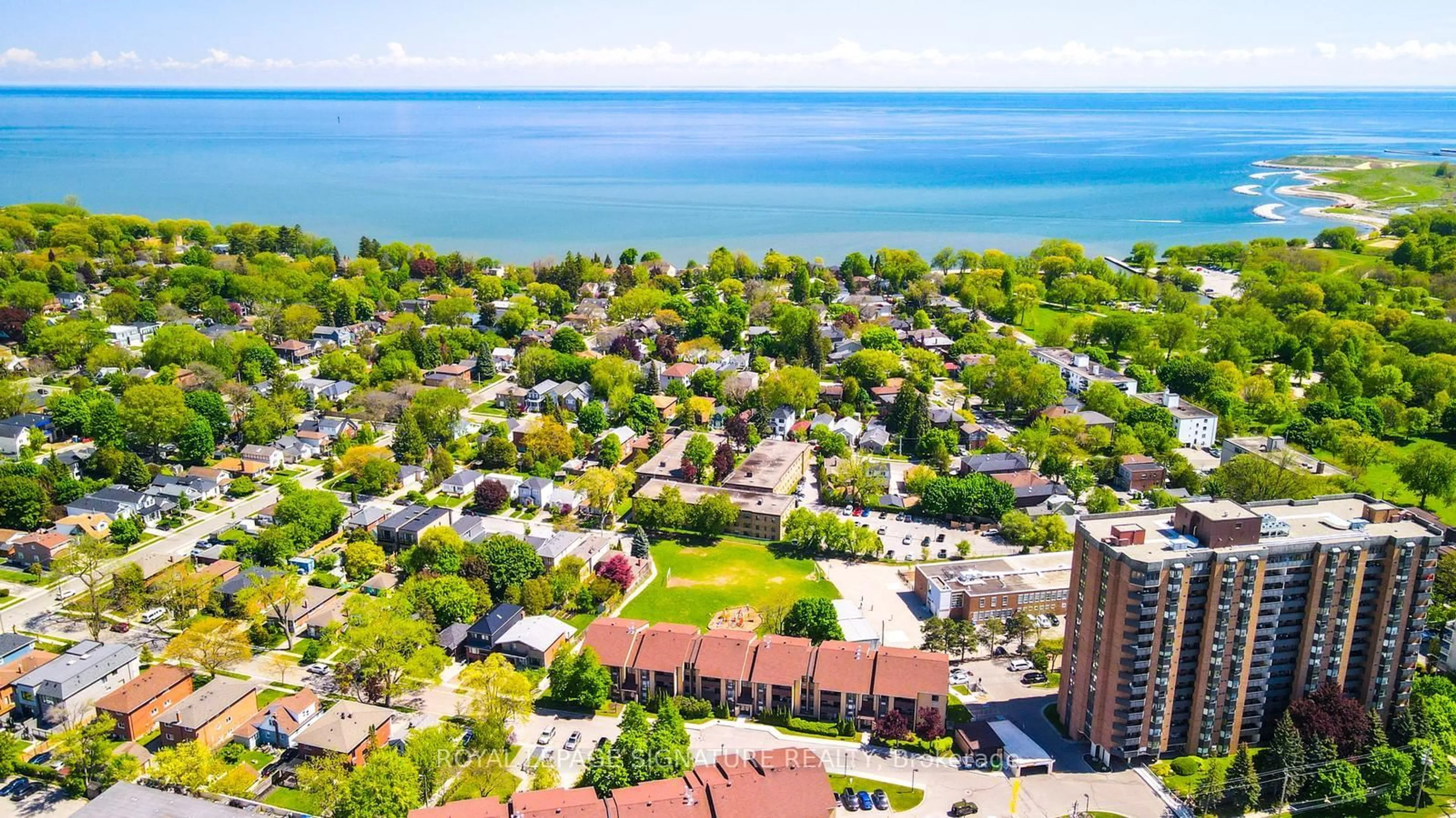 A pic from outside/outdoor area/front of a property/back of a property/a pic from drone, water/lake/river/ocean view for 3841 Lake Shore Blvd #218, Toronto Ontario M8W 1R2
