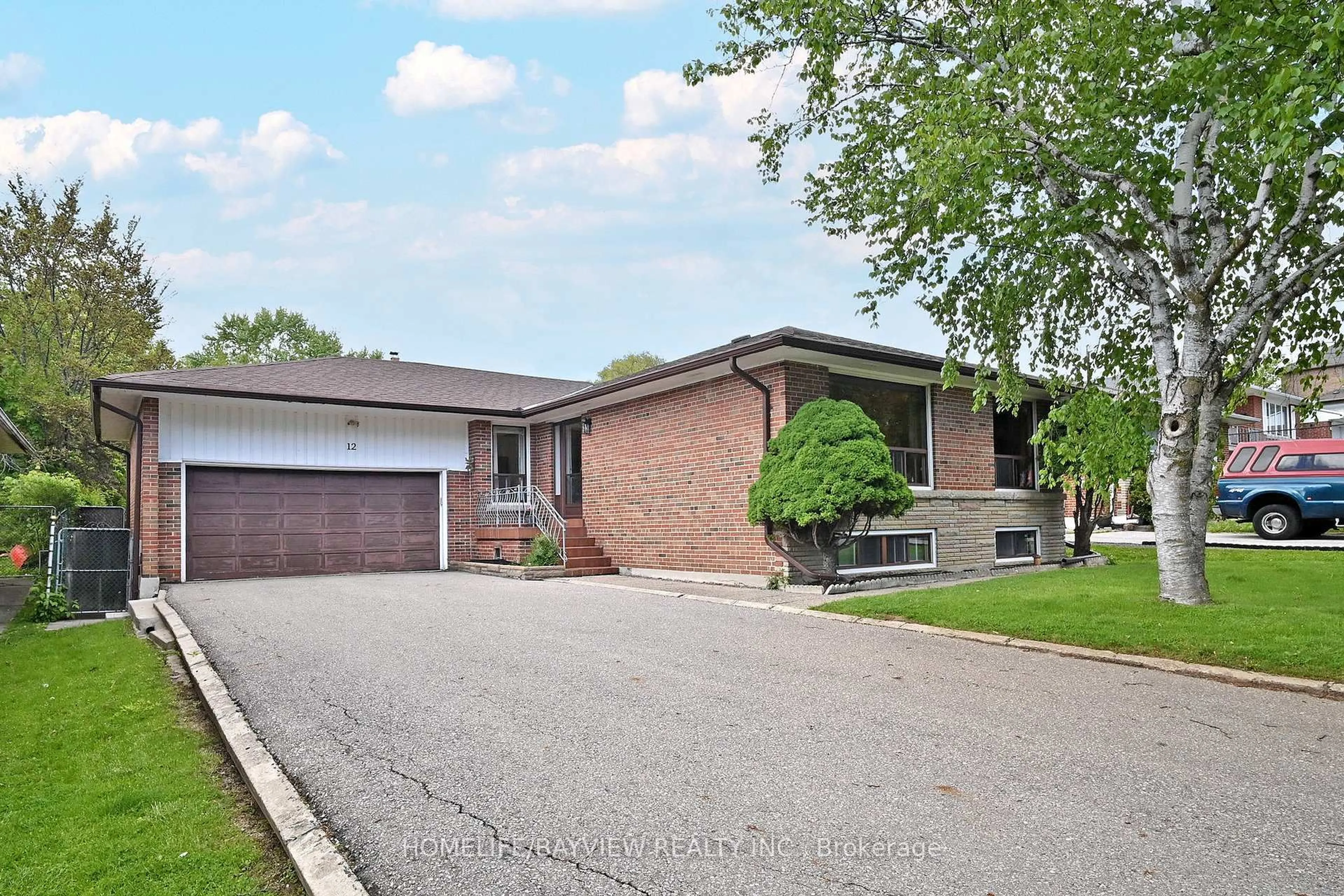 Home with brick exterior material, street for 12 Quinan Dr, Toronto Ontario M6L 1E9