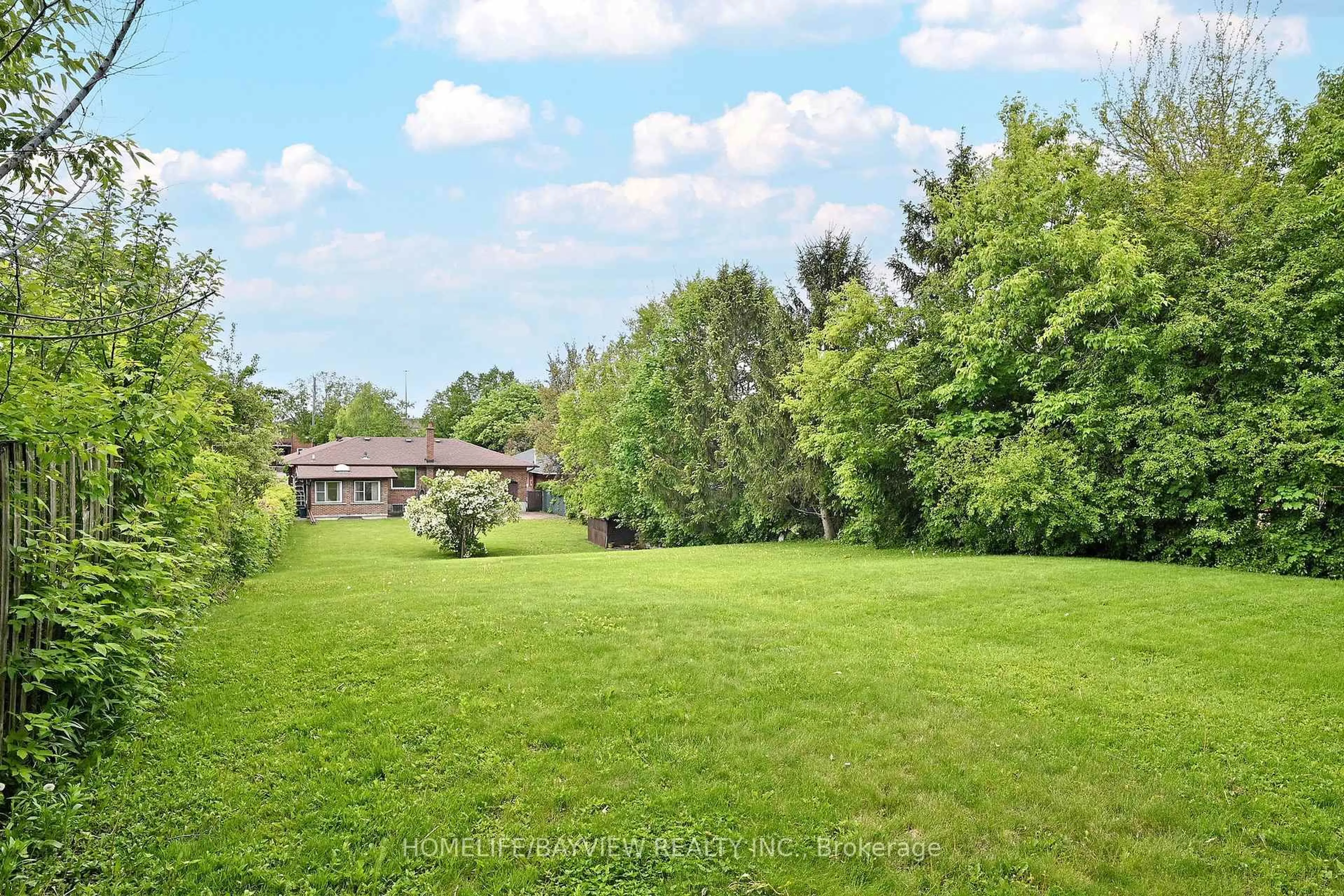 A pic from outside/outdoor area/front of a property/back of a property/a pic from drone, forest/trees view for 12 Quinan Dr, Toronto Ontario M6L 1E9