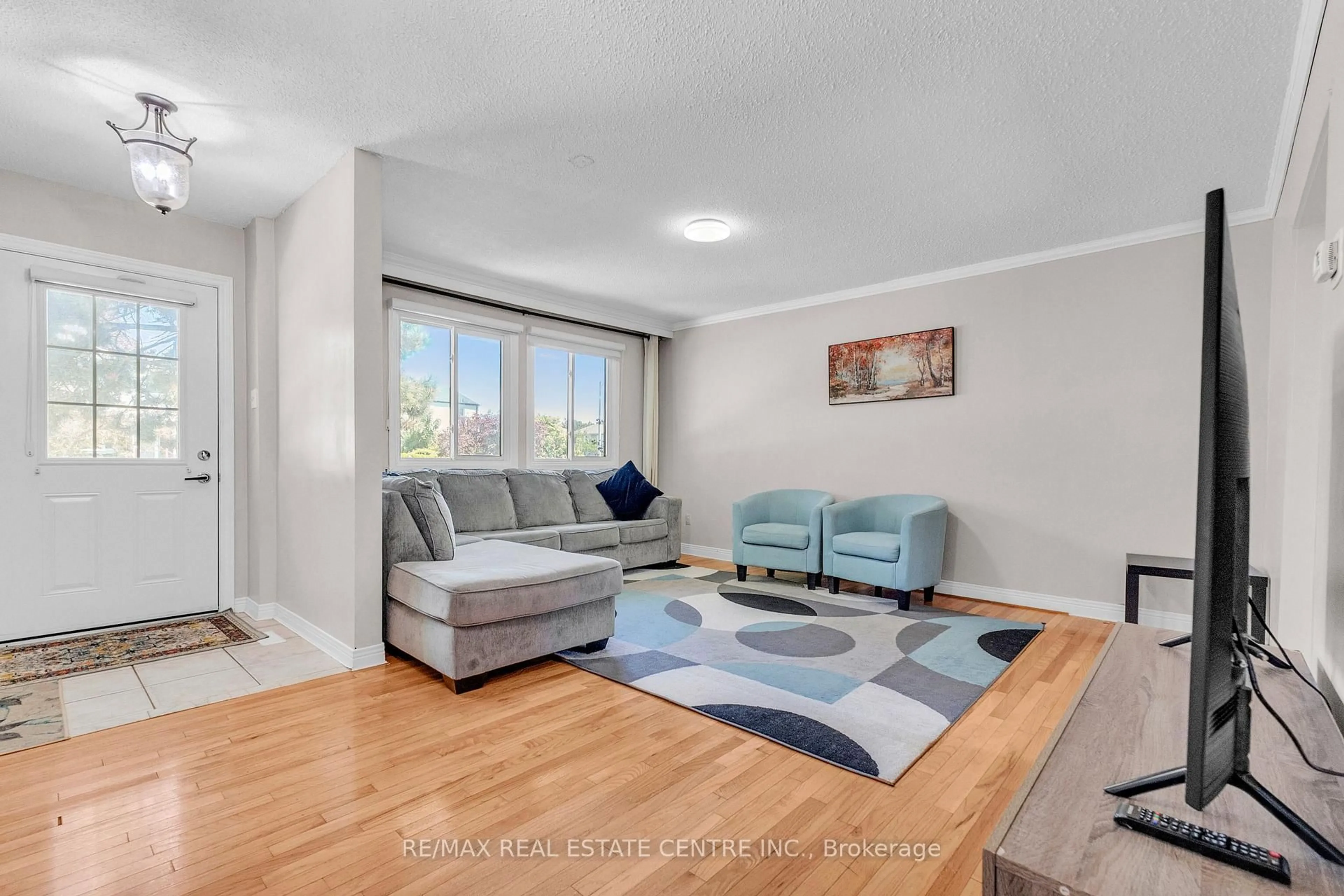 Living room with furniture, unknown for 105 Hansen Rd #102, Brampton Ontario L6V 3C9