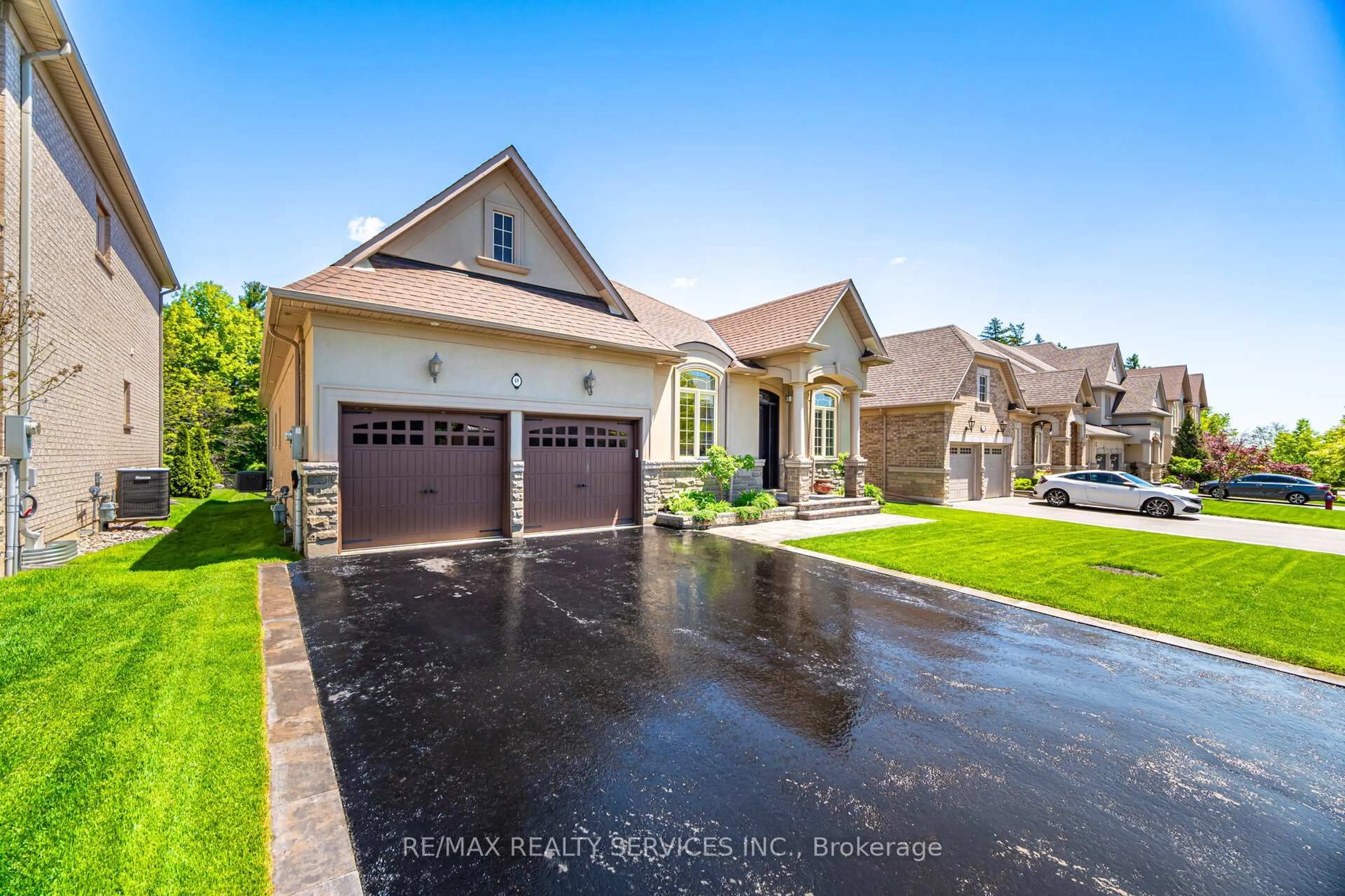 Home with brick exterior material, street for 48 Beacon Hill Dr, Brampton Ontario L6X 0V7