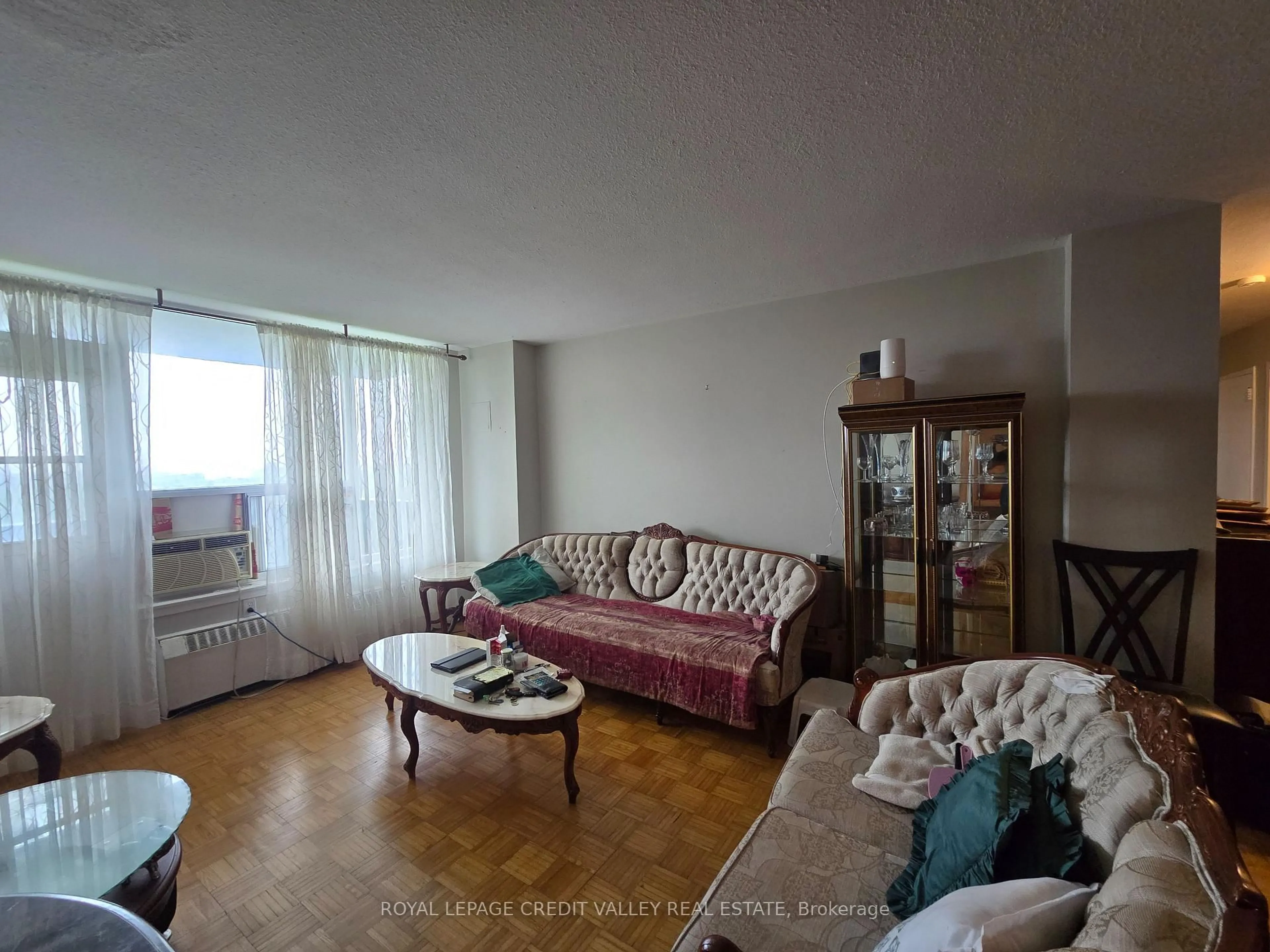 Living room with furniture, floor is not visible for 235 Grandravine Dr #1705, Toronto Ontario M3N 1J2