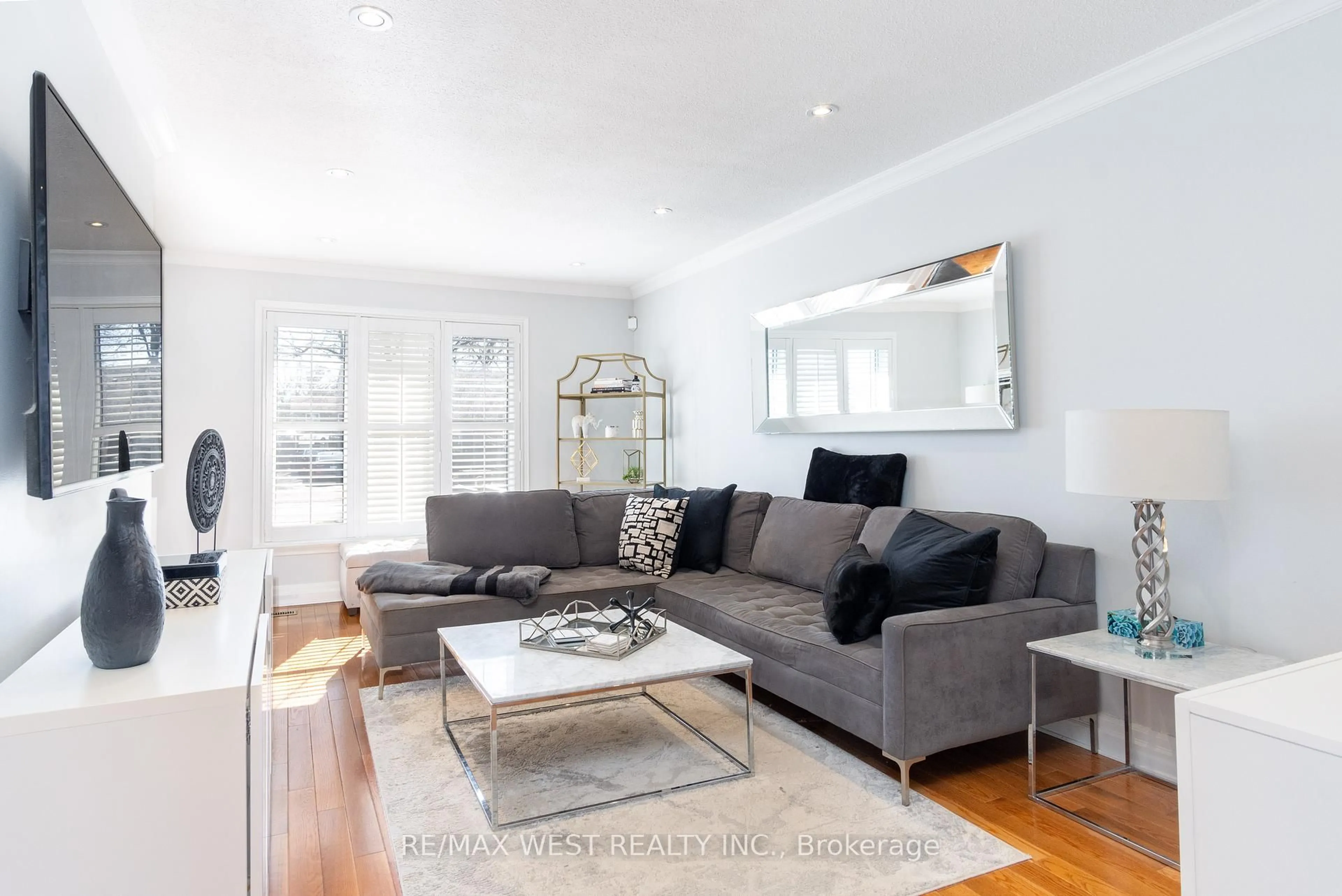 Living room with furniture, wood/laminate floor for 30 Tindale Rd, Brampton Ontario L6V 2G9