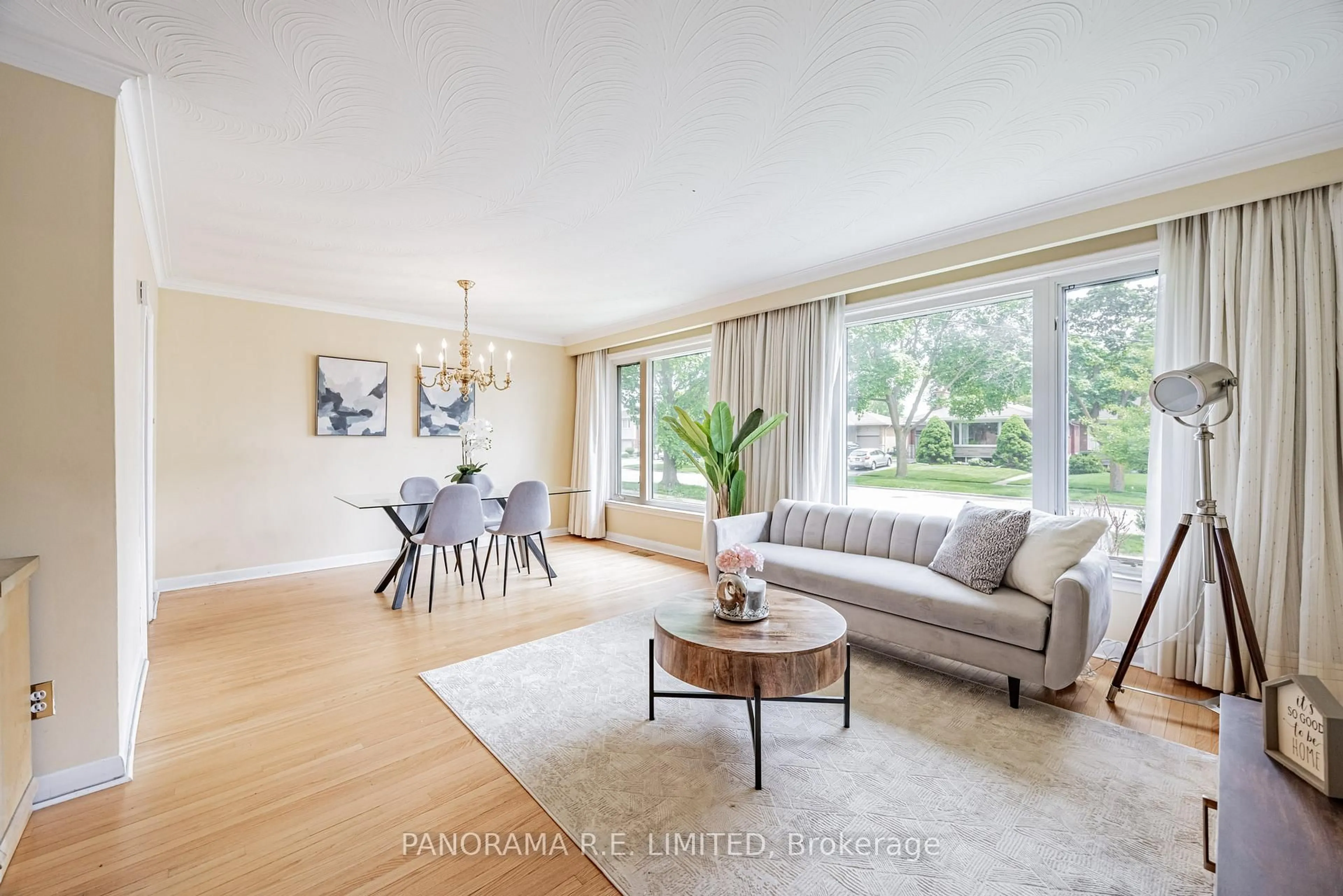 Living room with furniture, wood/laminate floor for 34 Fenley Dr, Toronto Ontario M9R 1M4
