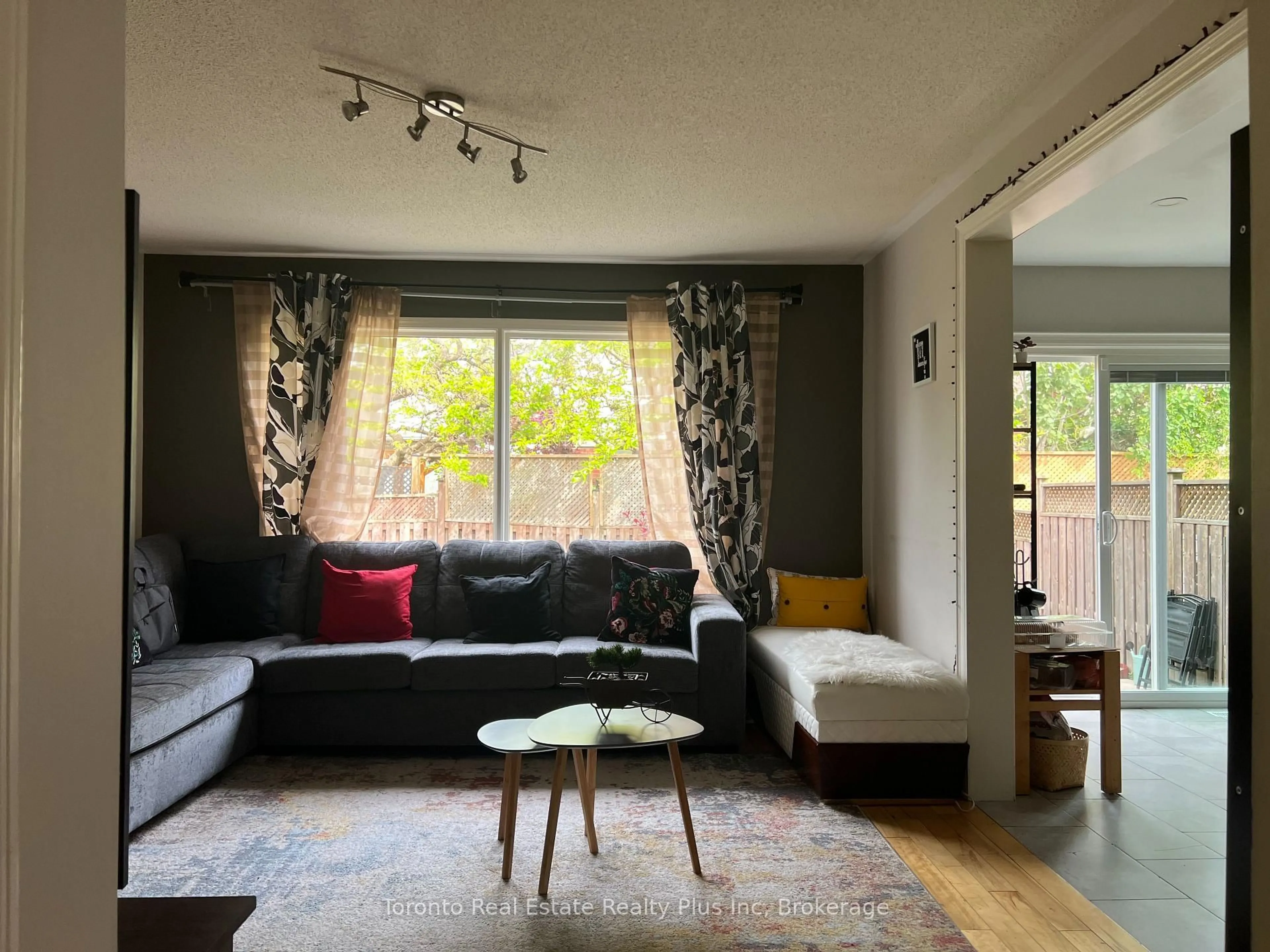 Living room with furniture, wood/laminate floor for 719 Hutchinson Ave, Milton Ontario L9T 6A6