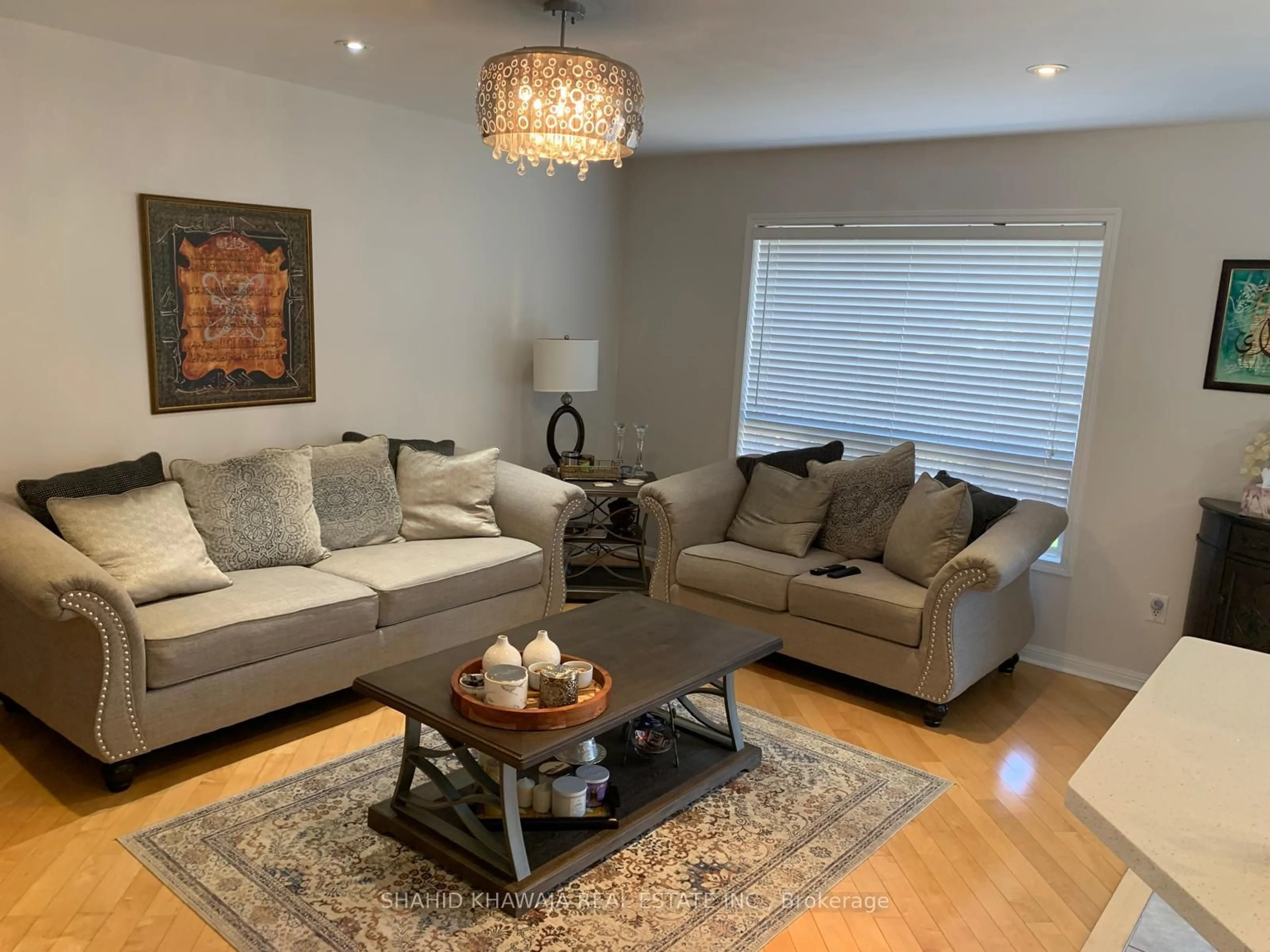 Living room with furniture, wood/laminate floor for 841 Gifford Cres, Milton Ontario L9T 0L2