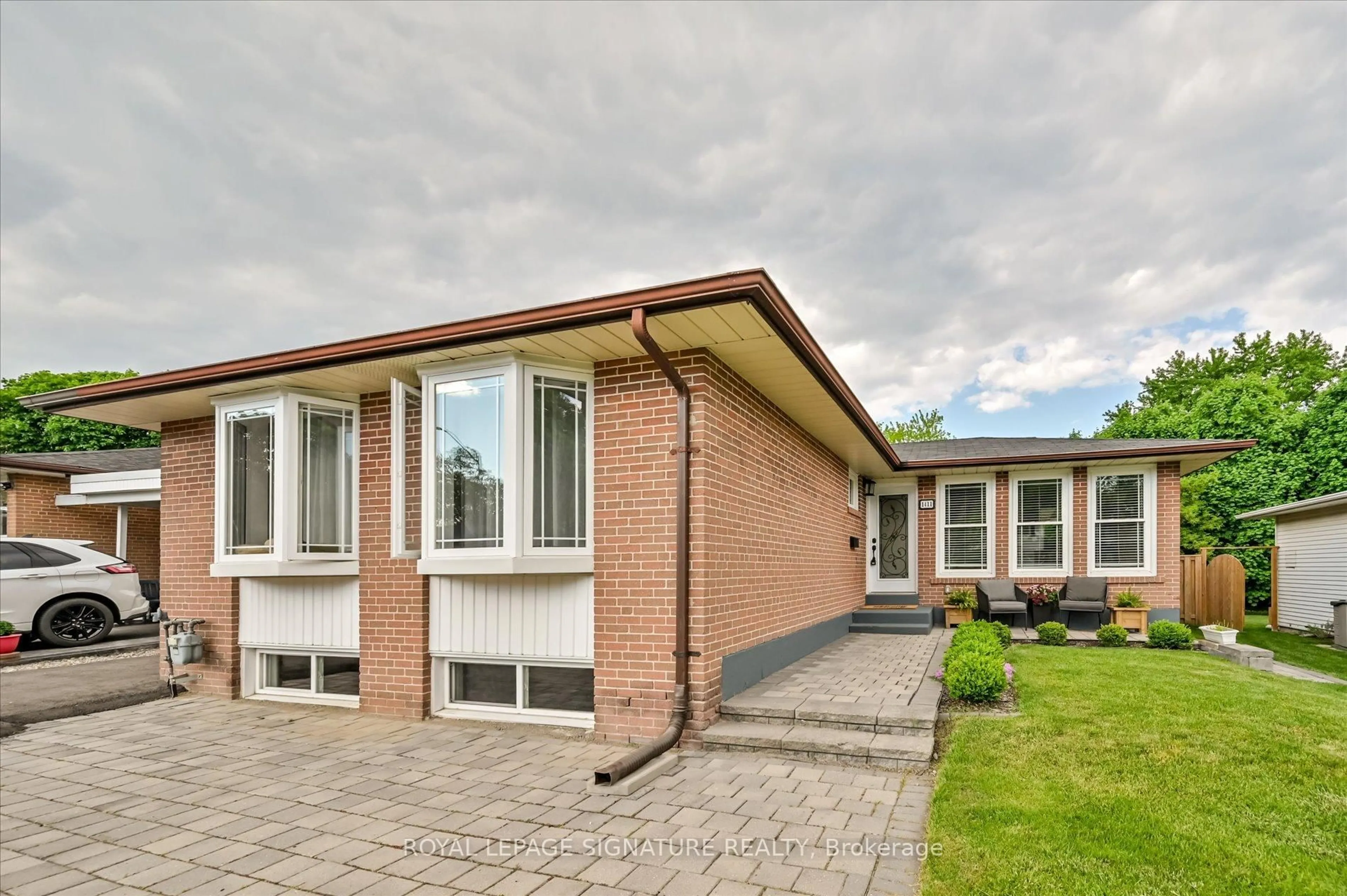 Home with brick exterior material, street for 1411 Lewisham Dr, Mississauga Ontario L5J 3R2