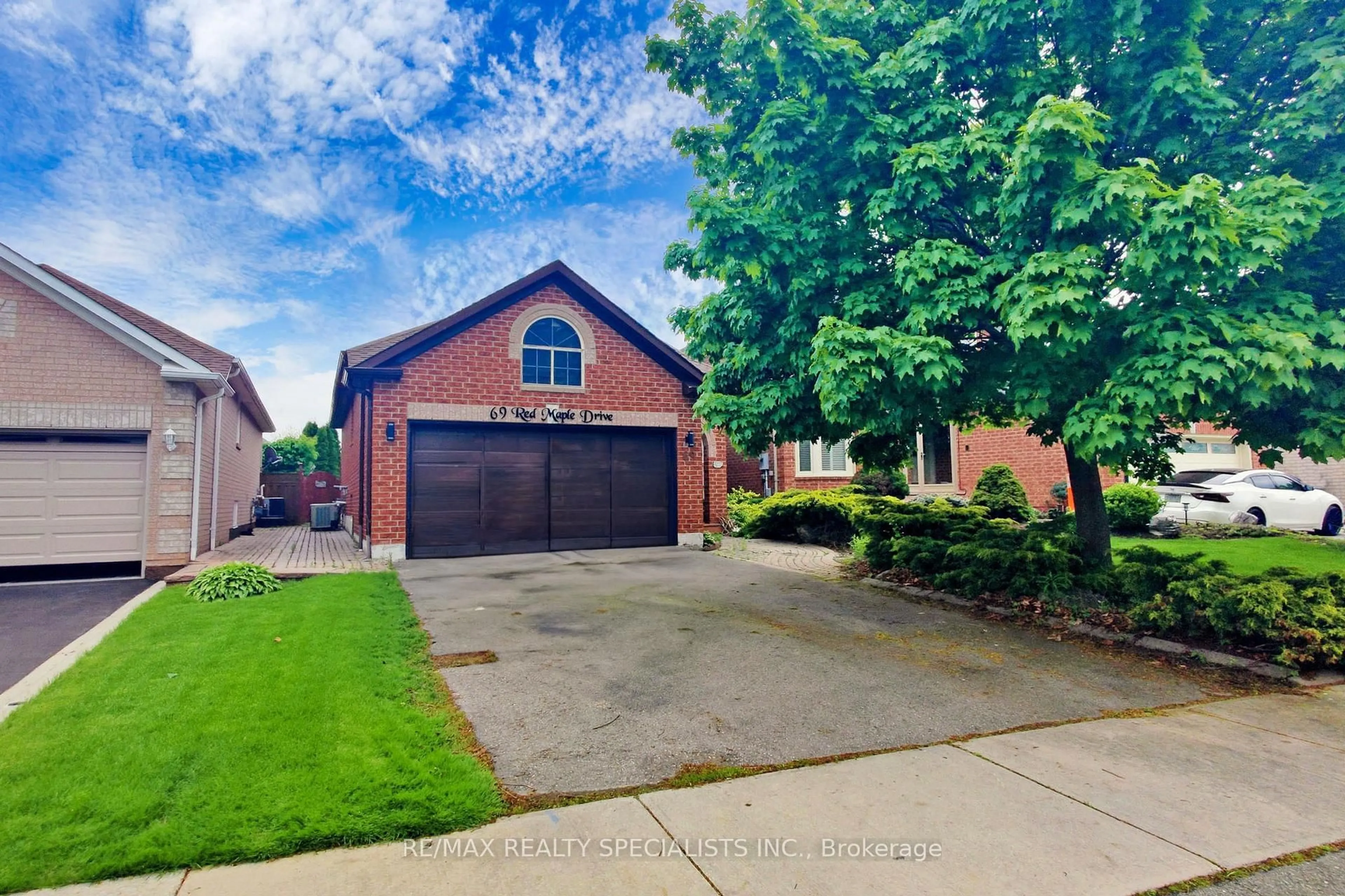 Home with brick exterior material, street for 69 Red Maple Dr, Brampton Ontario L6X 4M1
