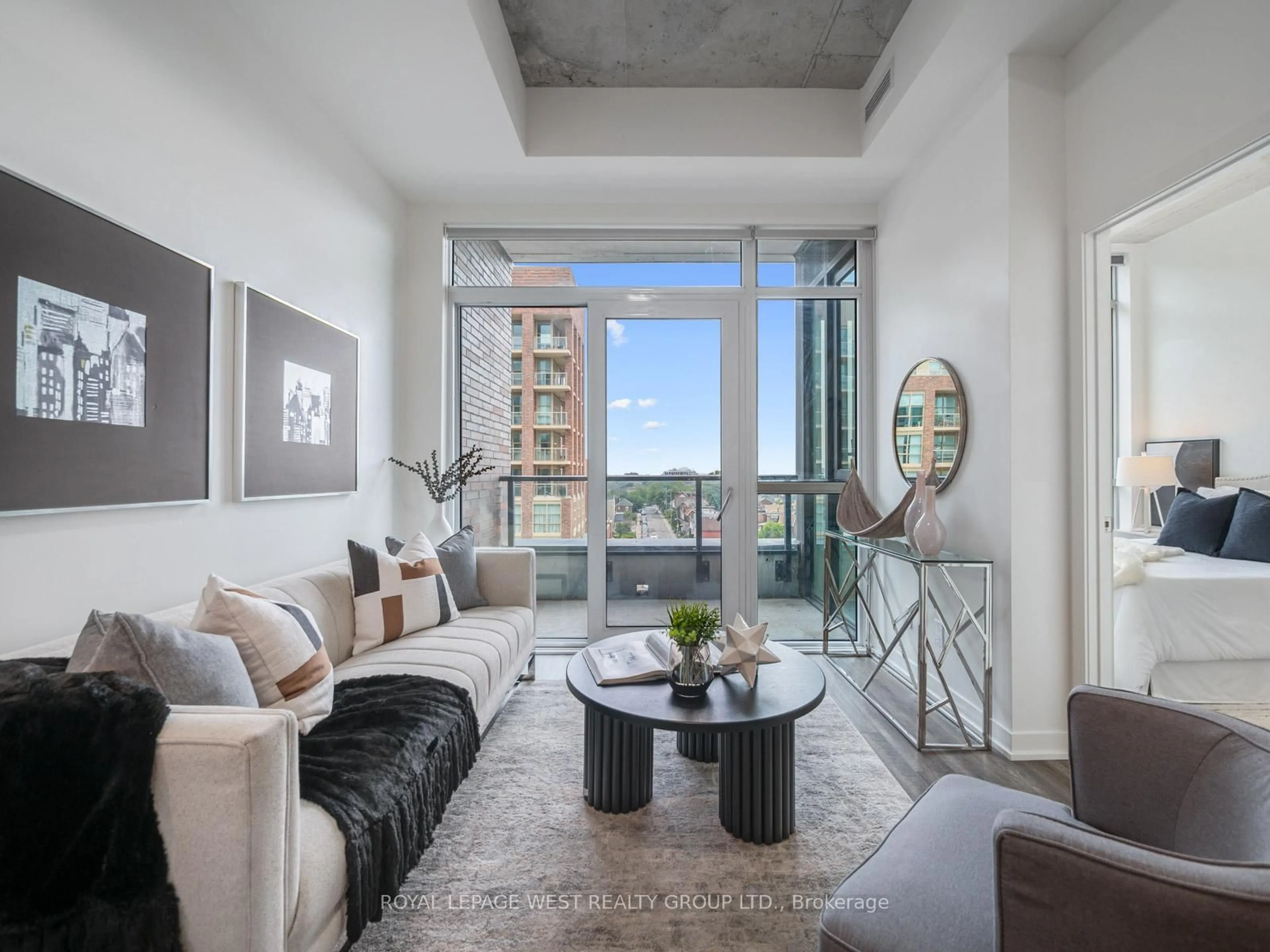 Living room with furniture, cement floor for 1808 St Clair Ave #713, Toronto Ontario M6N 0C1