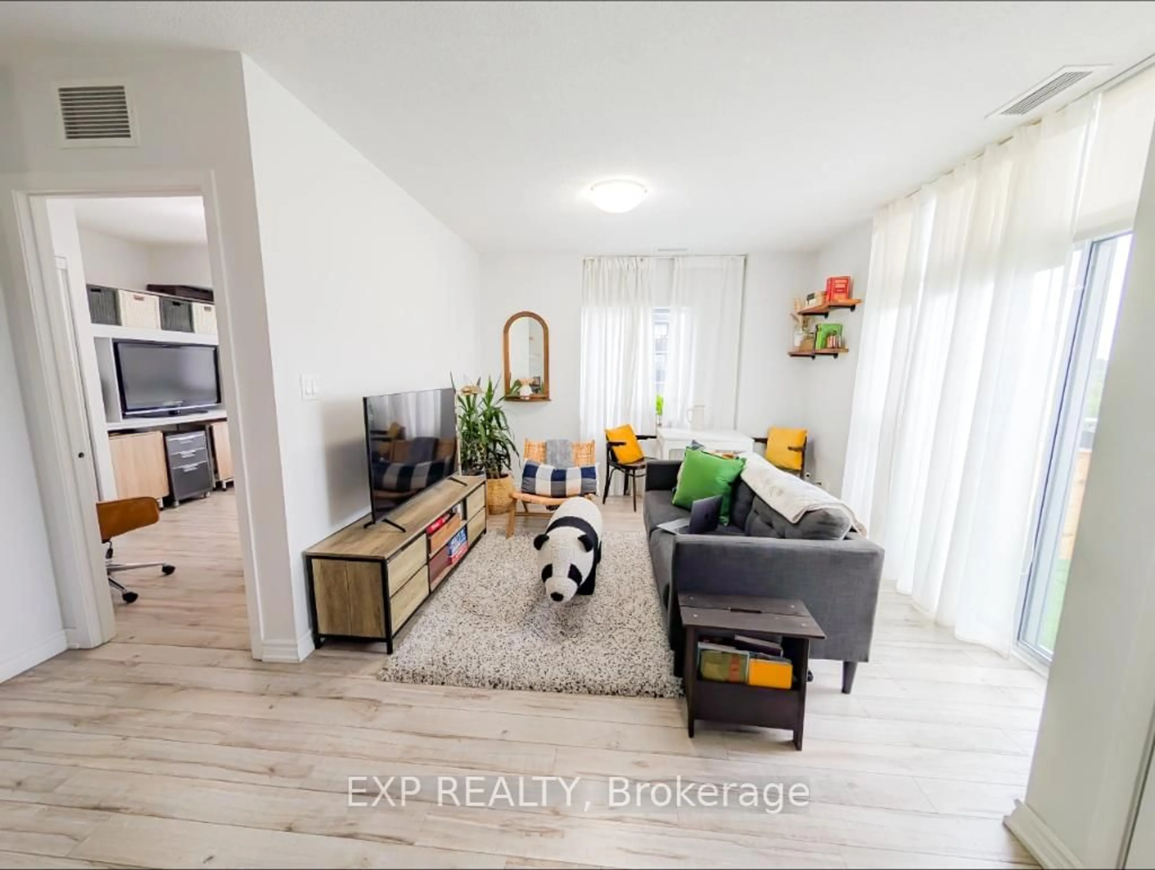 Living room with furniture, wood/laminate floor for 2464 Weston Rd, Toronto Ontario M9N 0A2