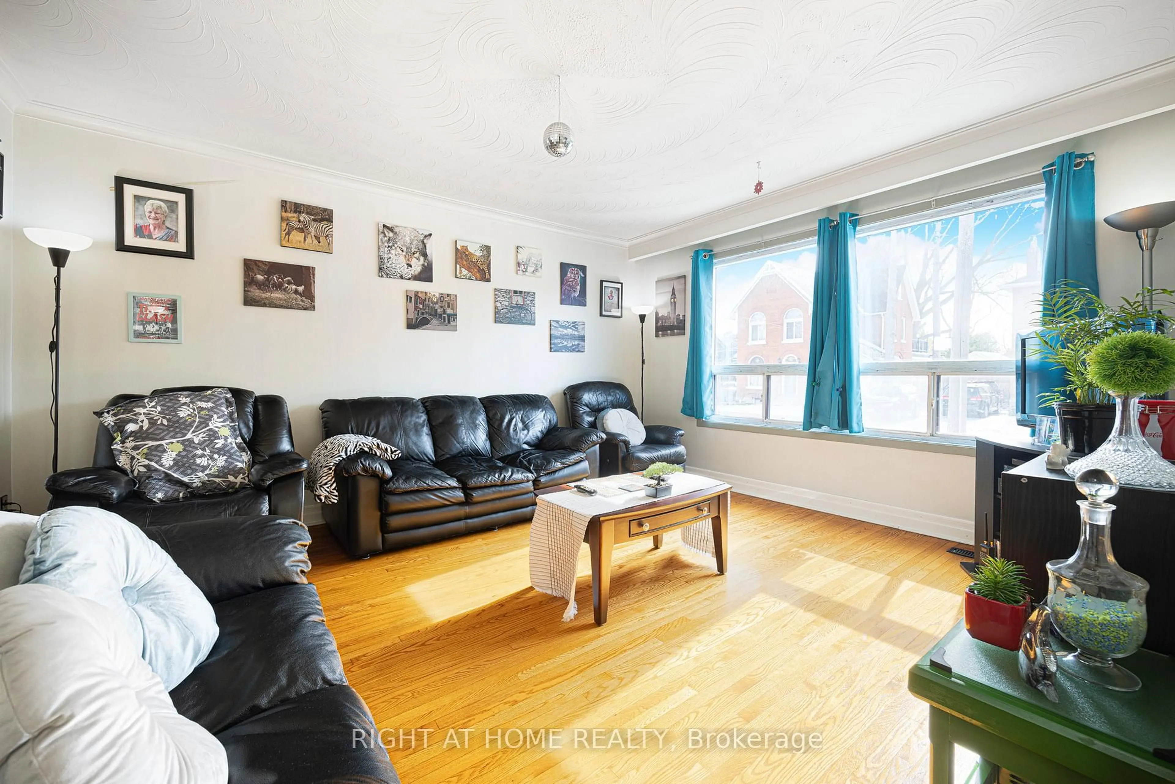 Living room with furniture, wood/laminate floor for 56 John St, Toronto Ontario M9N 1J7