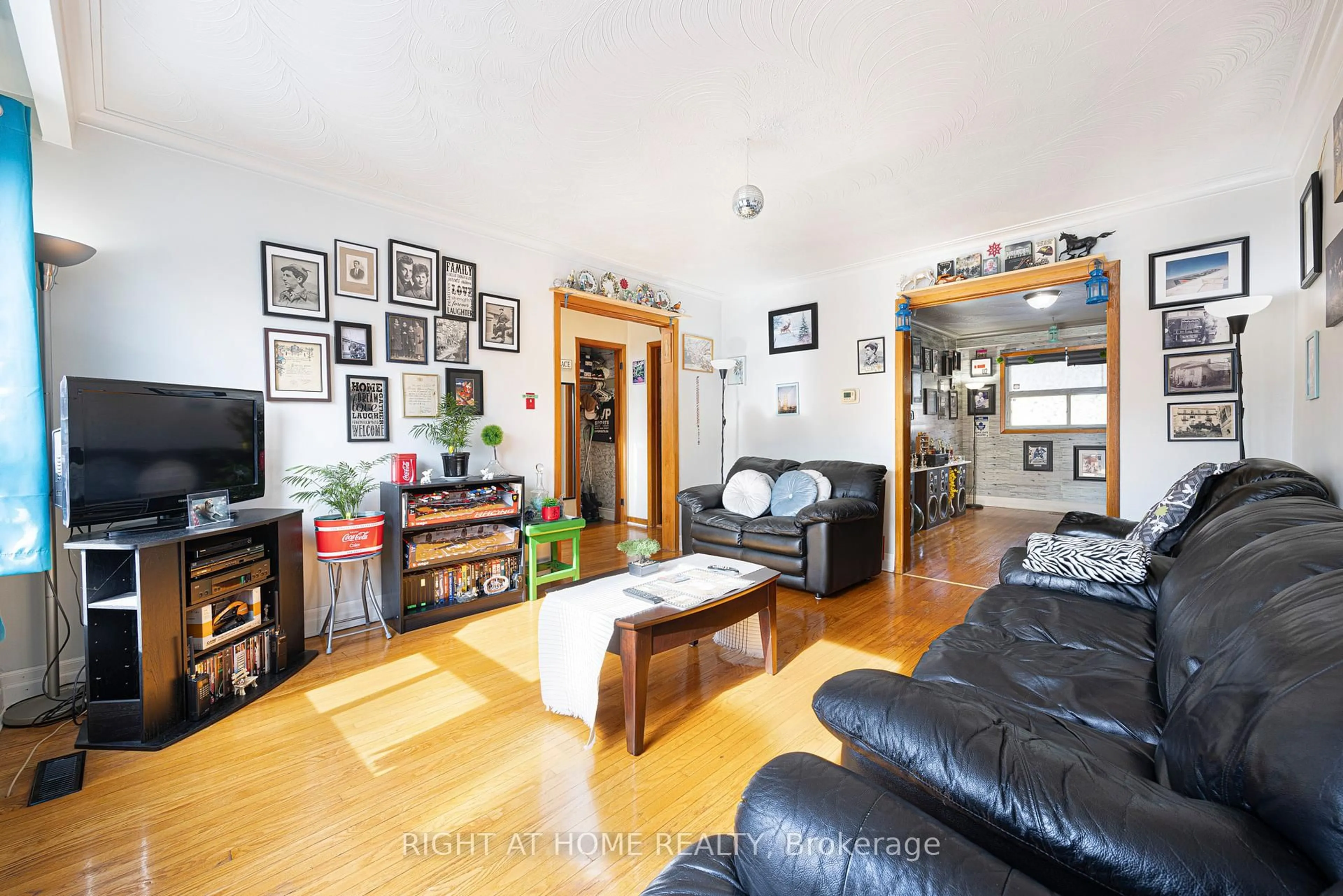 Living room with furniture, wood/laminate floor for 56 John St, Toronto Ontario M9N 1J7
