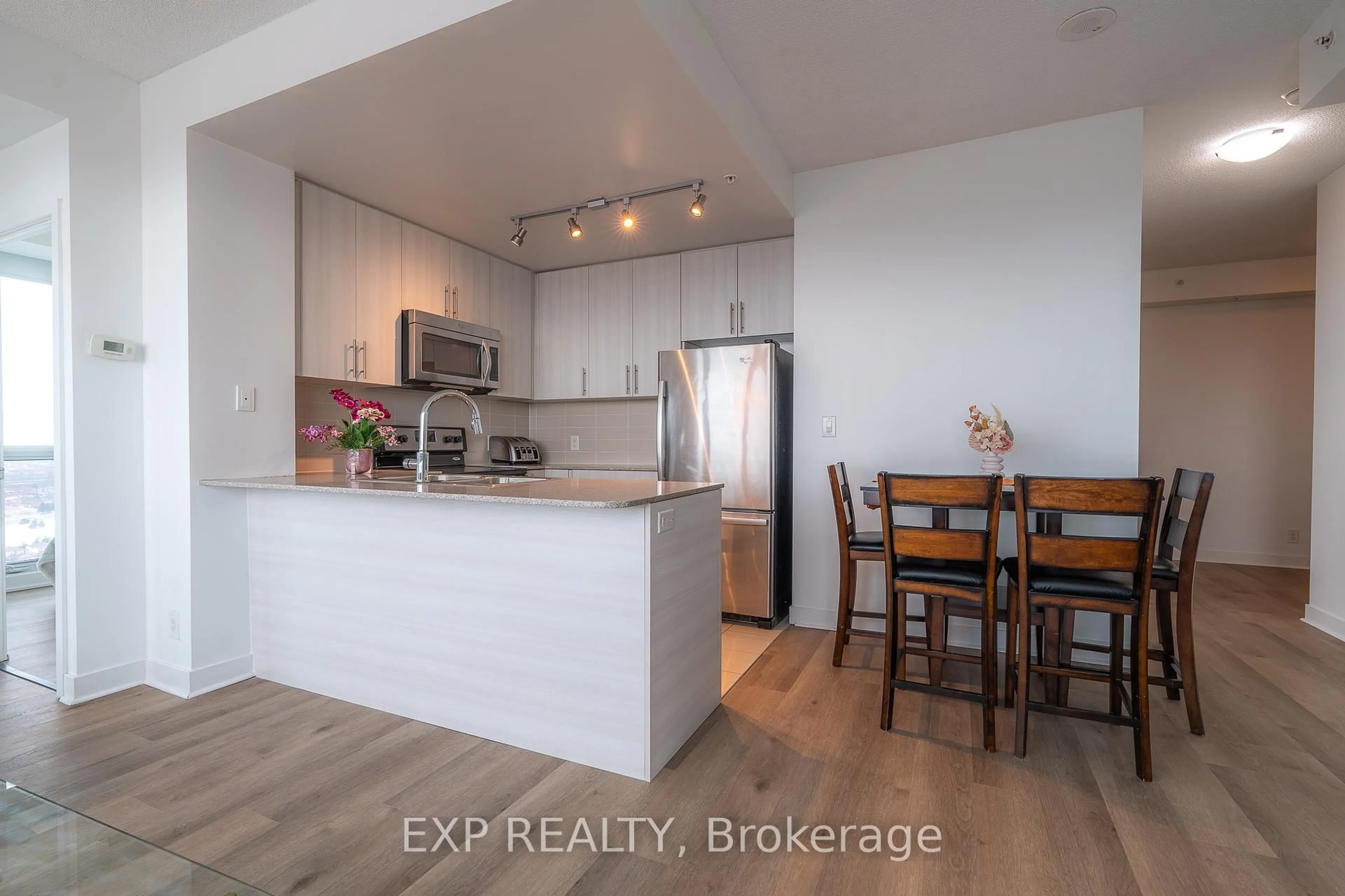 Open concept kitchen, wood/laminate floor for 3985 Grand Park Dr #2008, Mississauga Ontario L5B 0H8
