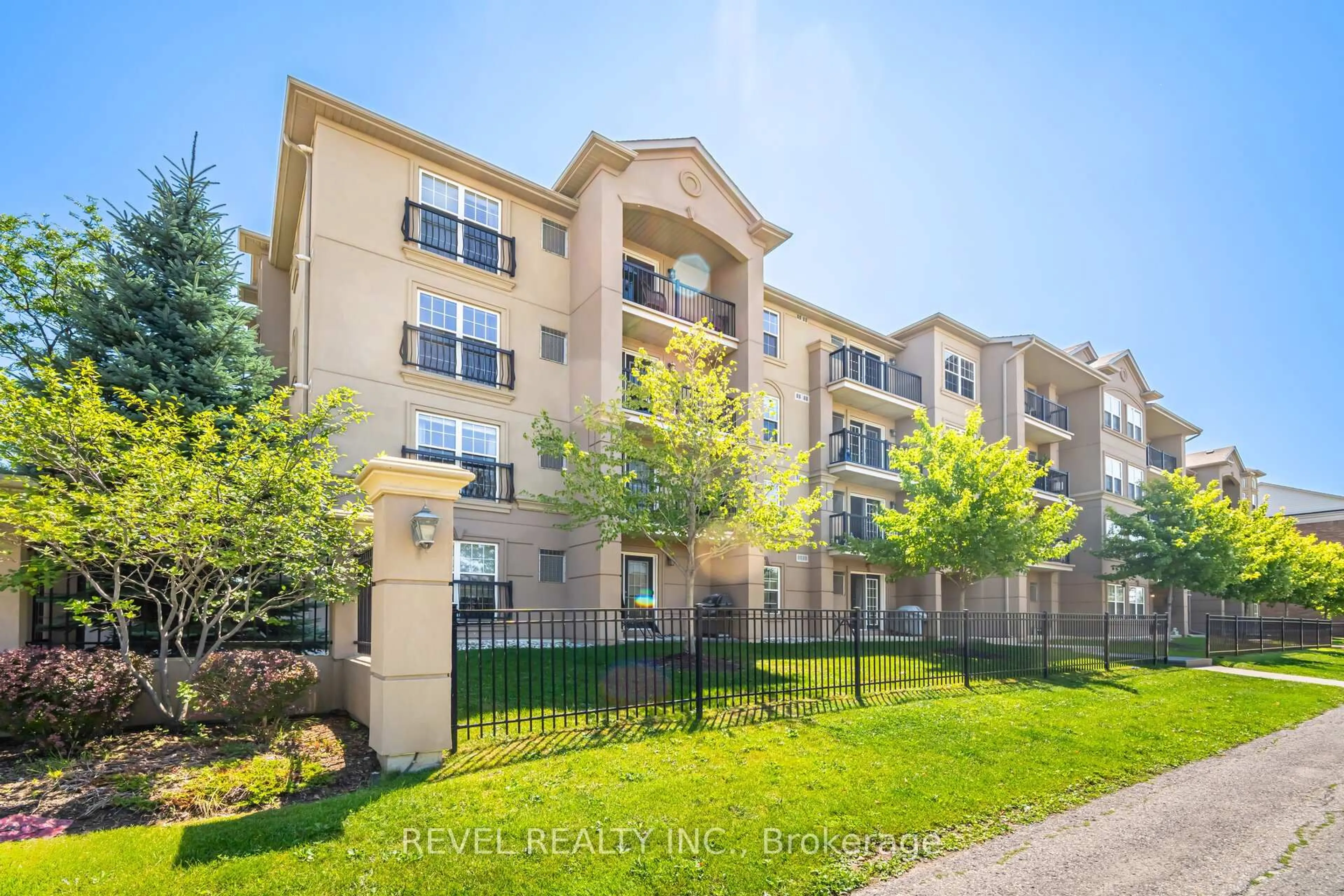 A pic from outside/outdoor area/front of a property/back of a property/a pic from drone, unknown for 1340 Main St #406, Milton Ontario L9T 7S6