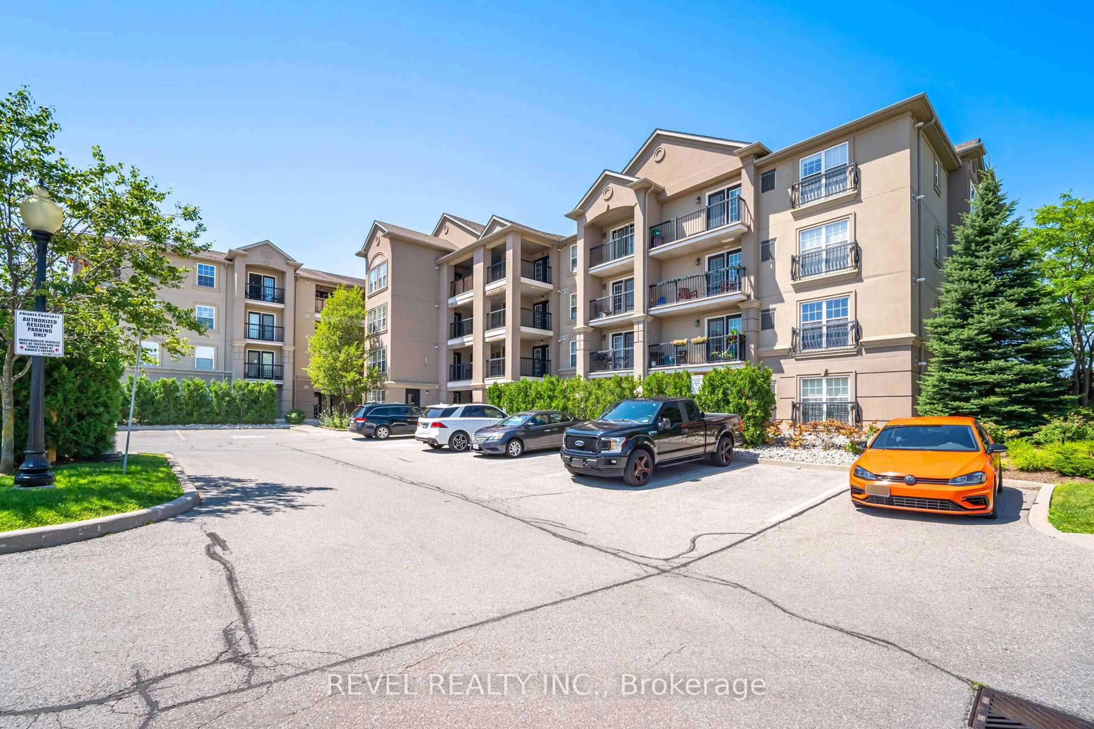 A pic from outside/outdoor area/front of a property/back of a property/a pic from drone, unknown for 1340 Main St #406, Milton Ontario L9T 7S6