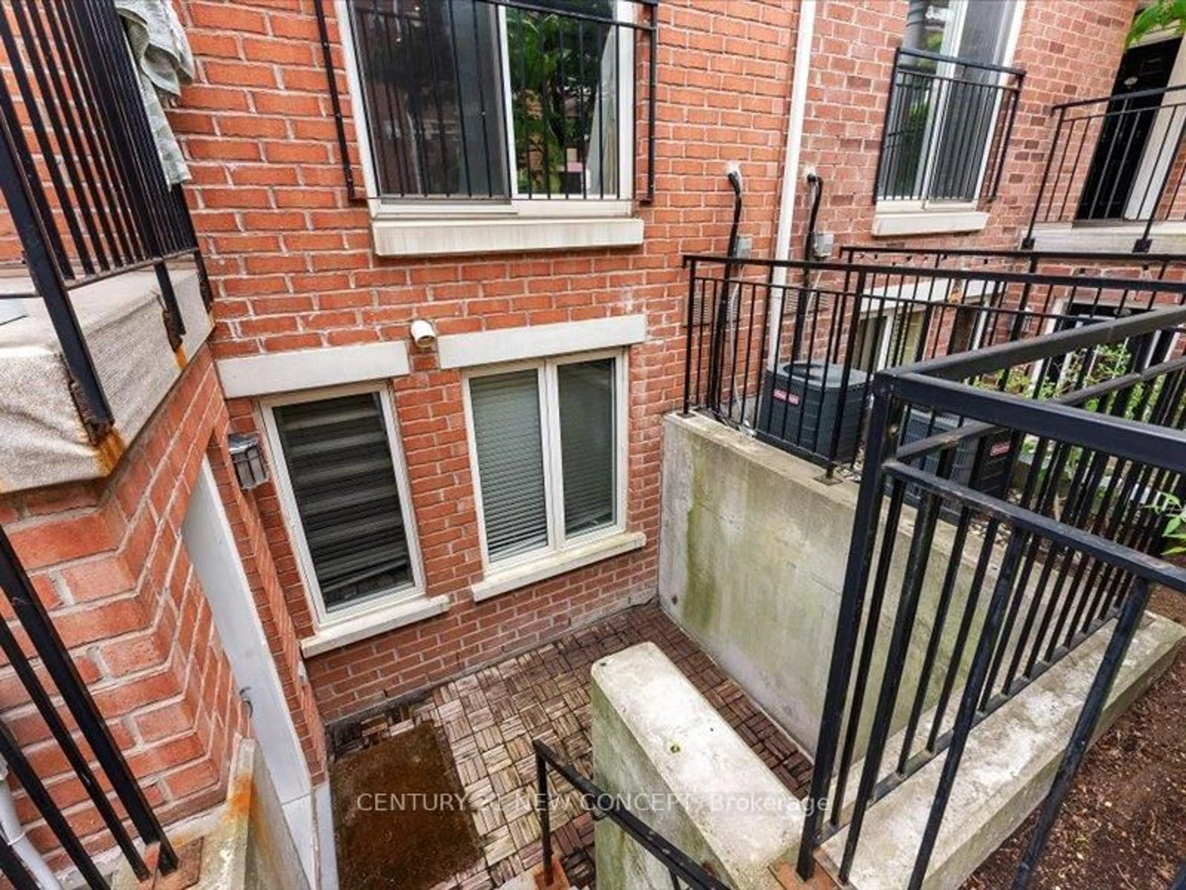 Patio, city buildings view from balcony for 10 Laidlaw St #Th725, Toronto Ontario M6K 1X2
