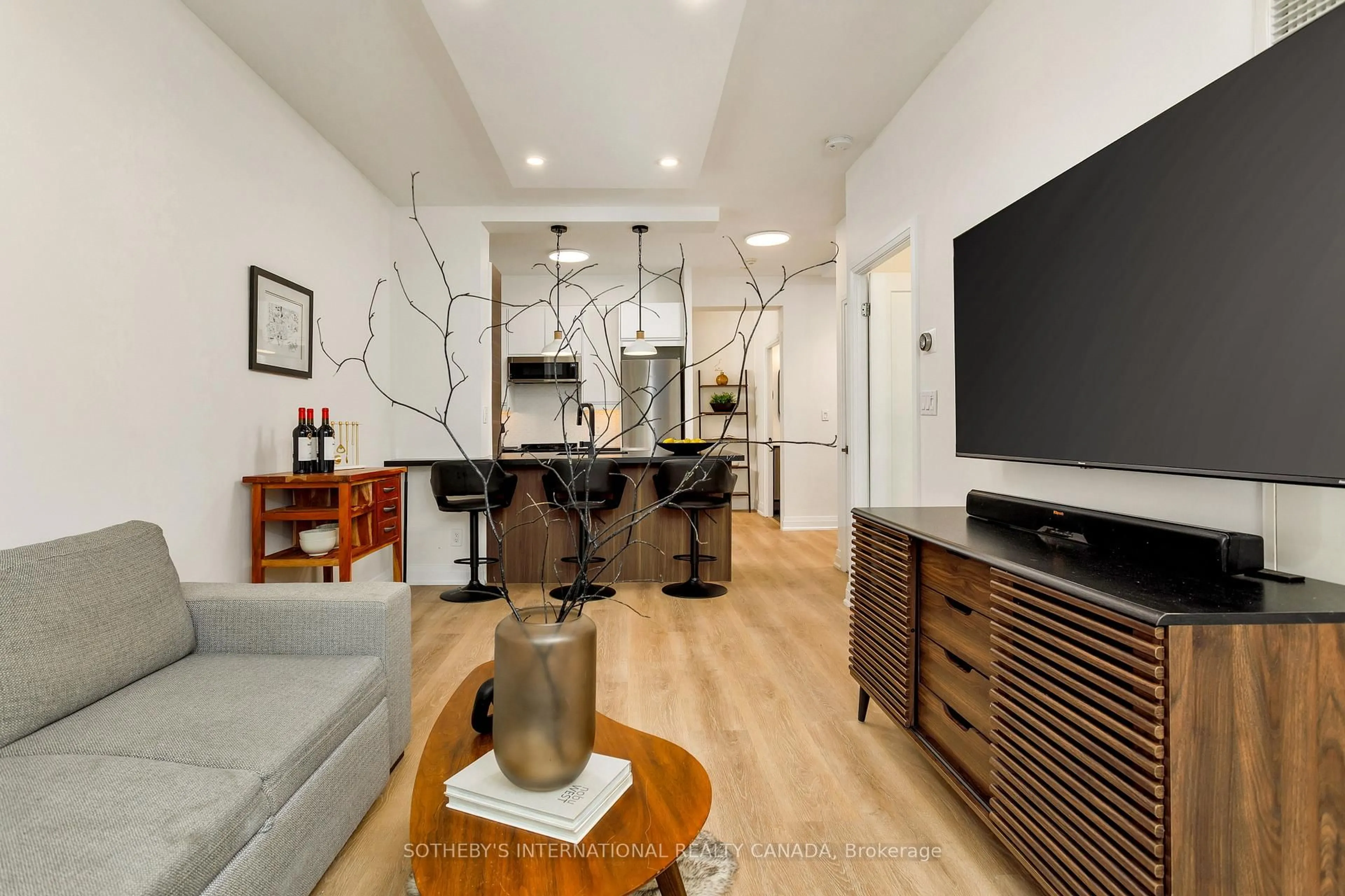 Living room with furniture, wood/laminate floor for 3391 Bloor St #201, Toronto Ontario M8X 1G3