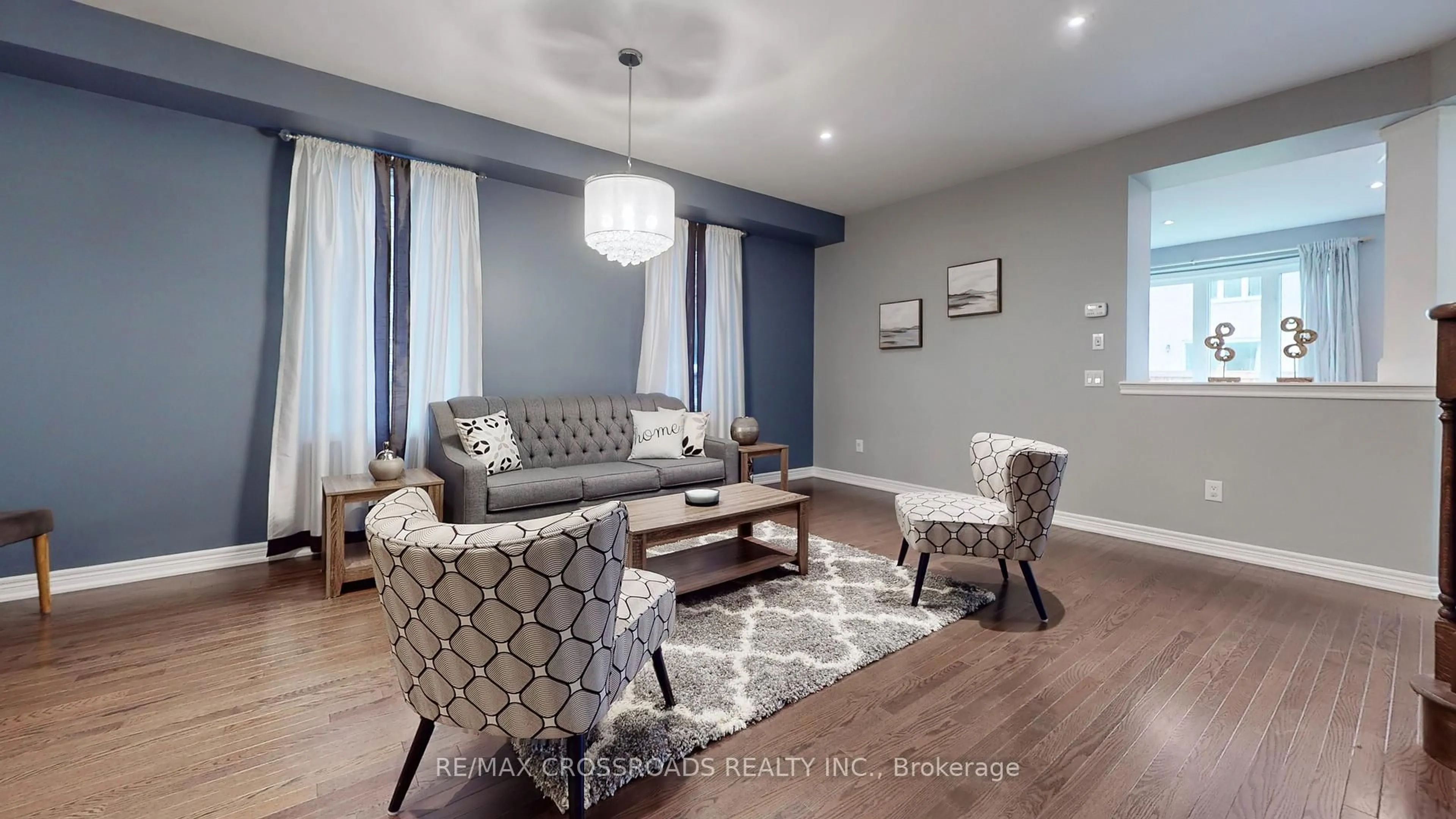 Living room with furniture, wood/laminate floor for 106 Larson Peak Rd, Caledon Ontario L7C 3P1