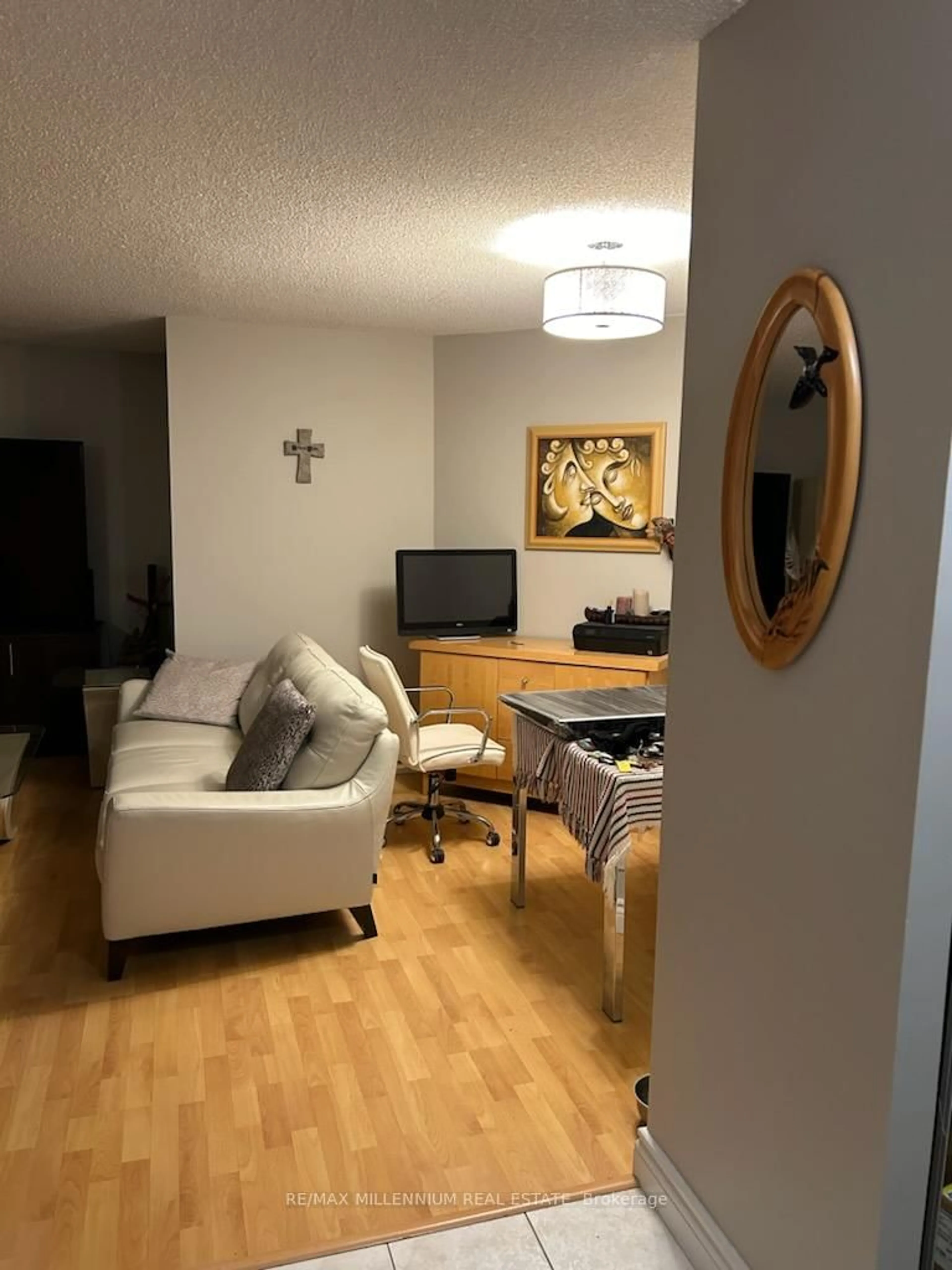 Living room with furniture, wood/laminate floor for 61 Markbrook Lane #811, Toronto Ontario M9V 5E7