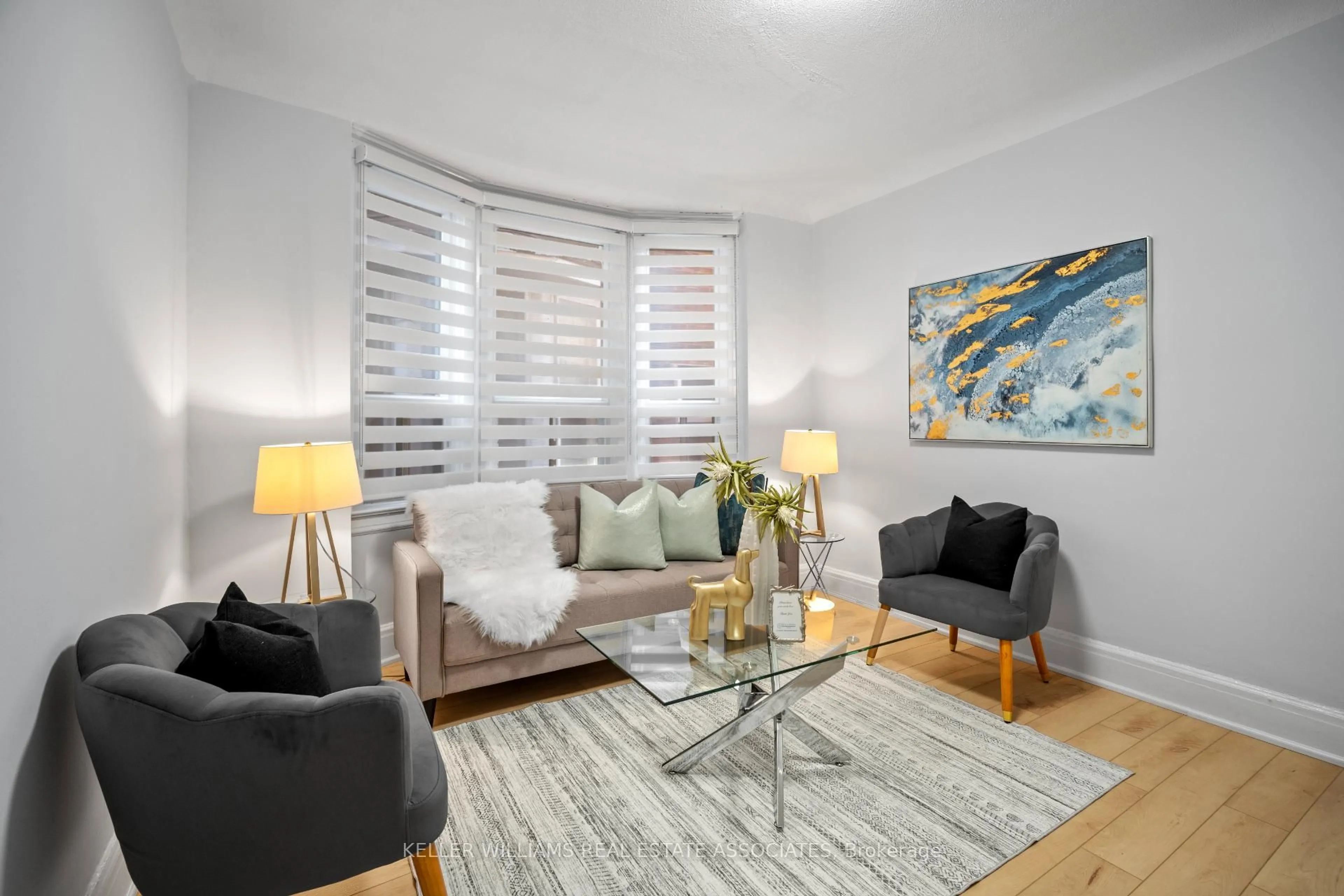 Living room with furniture, wood/laminate floor for 80 Mavety St, Toronto Ontario M6P 2L6