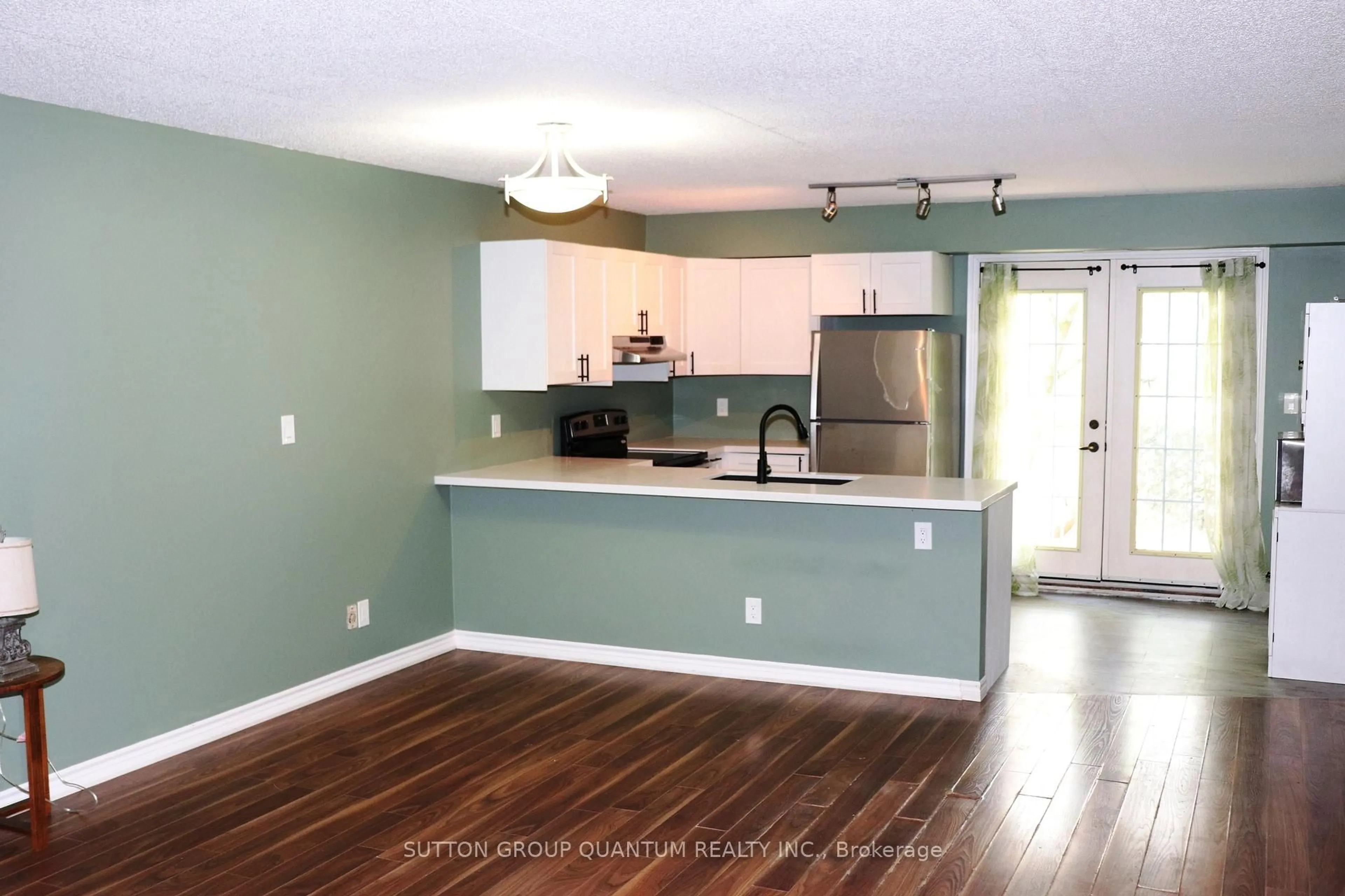 Open concept kitchen, wood/laminate floor for 4025 Kilmer Dr #301, Burlington Ontario L7M 4M5