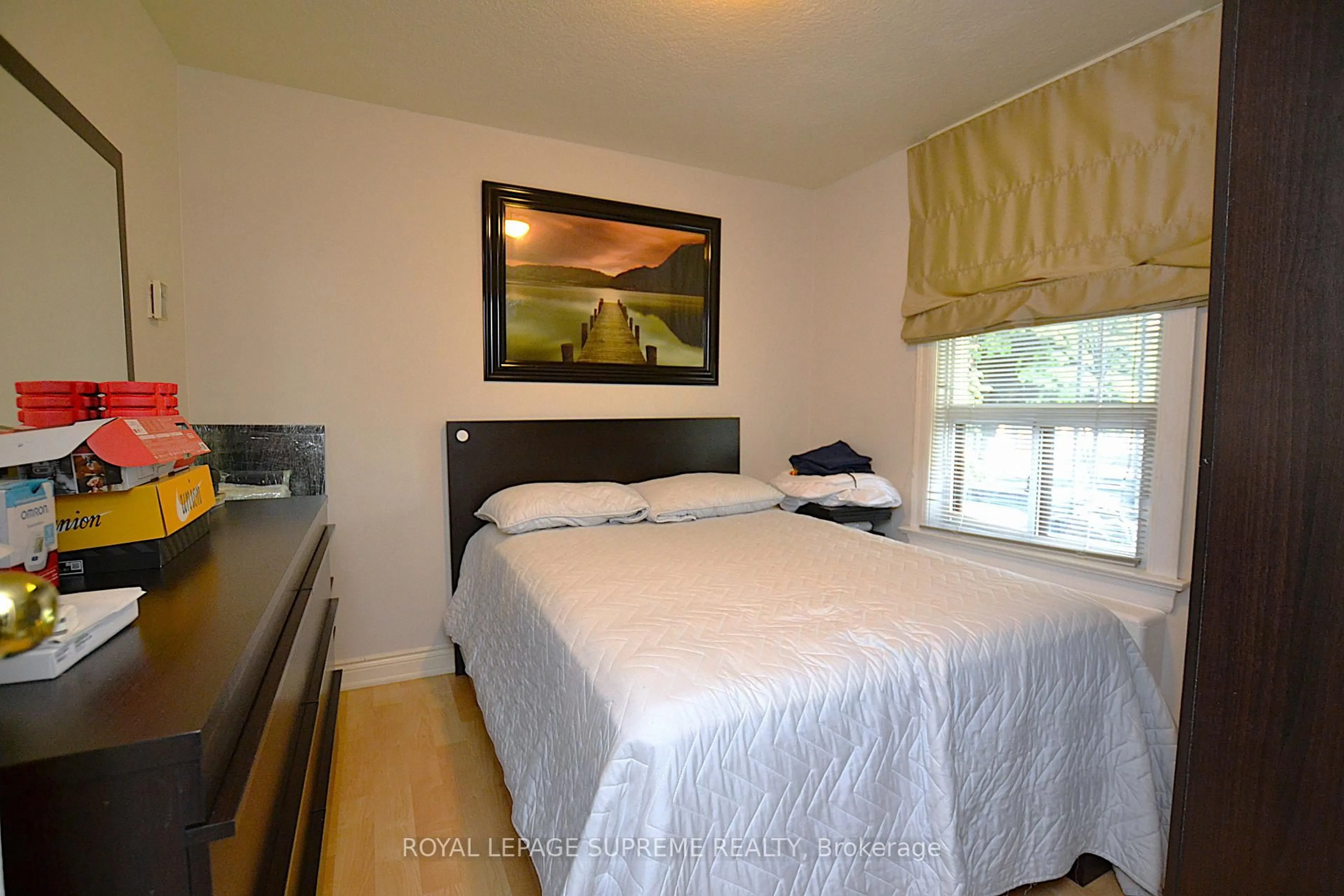 Bedroom with bed, wood/laminate floor for 4 Chandos Ave, Toronto Ontario M6H 2E5